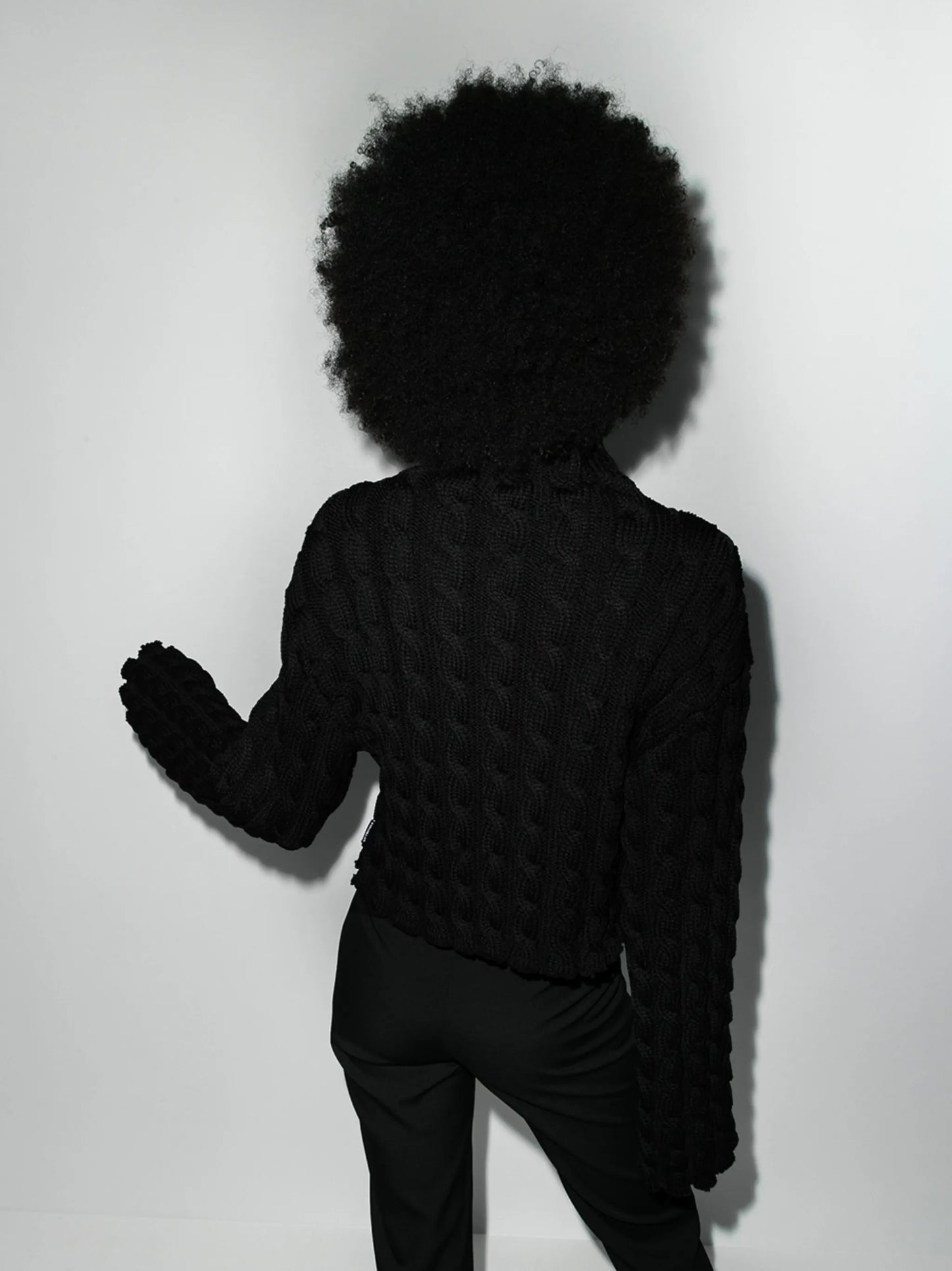 high-neck cable-knit jumper