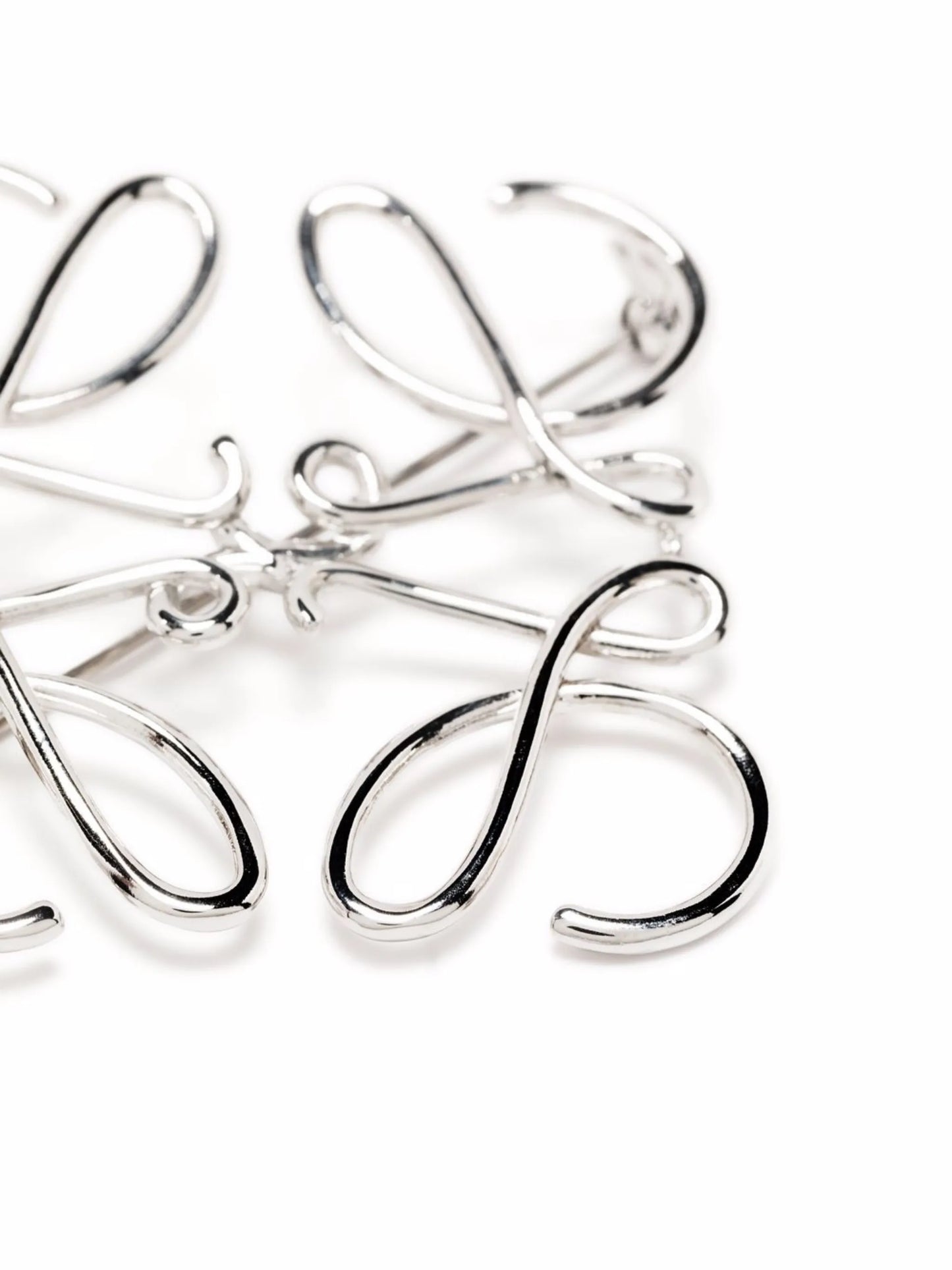 Anagram metal brooch