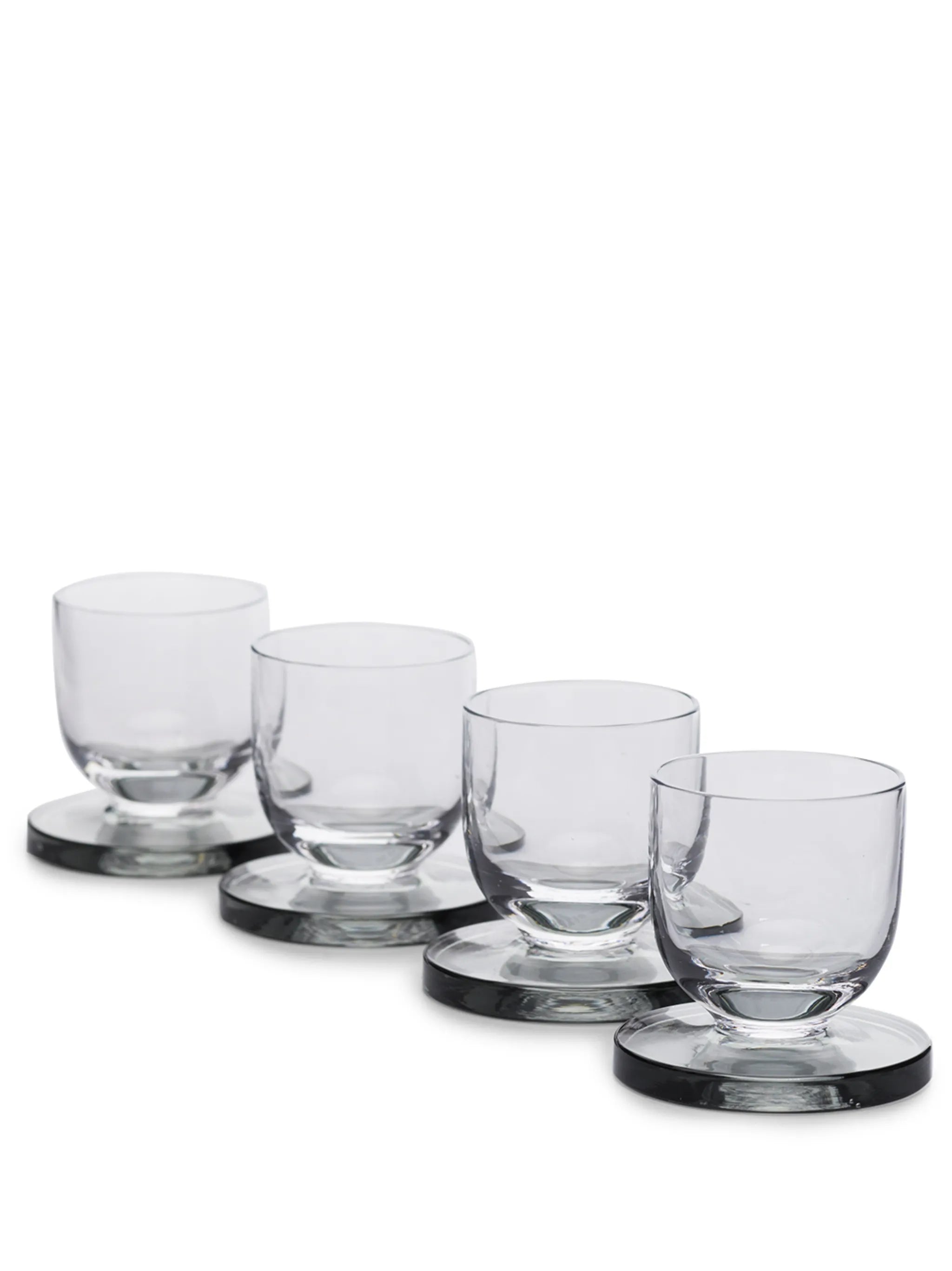 set of four Puck shot glasses