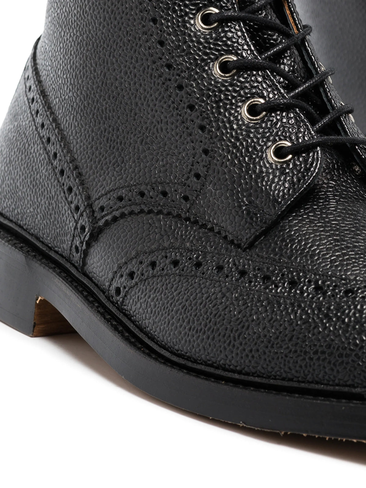 pebble grain leather wingtip boots with metal taps