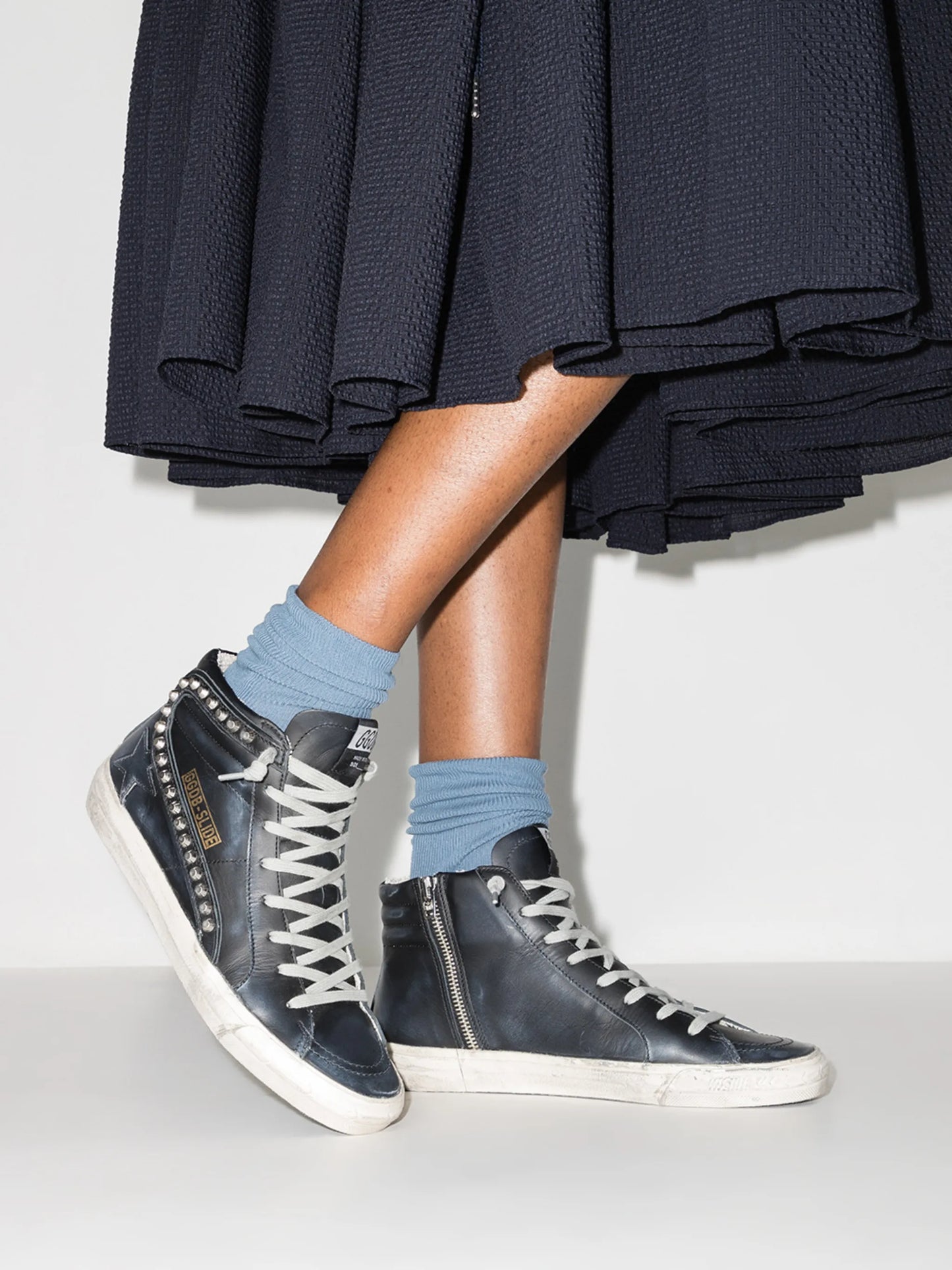 Slide distressed studded sneakers