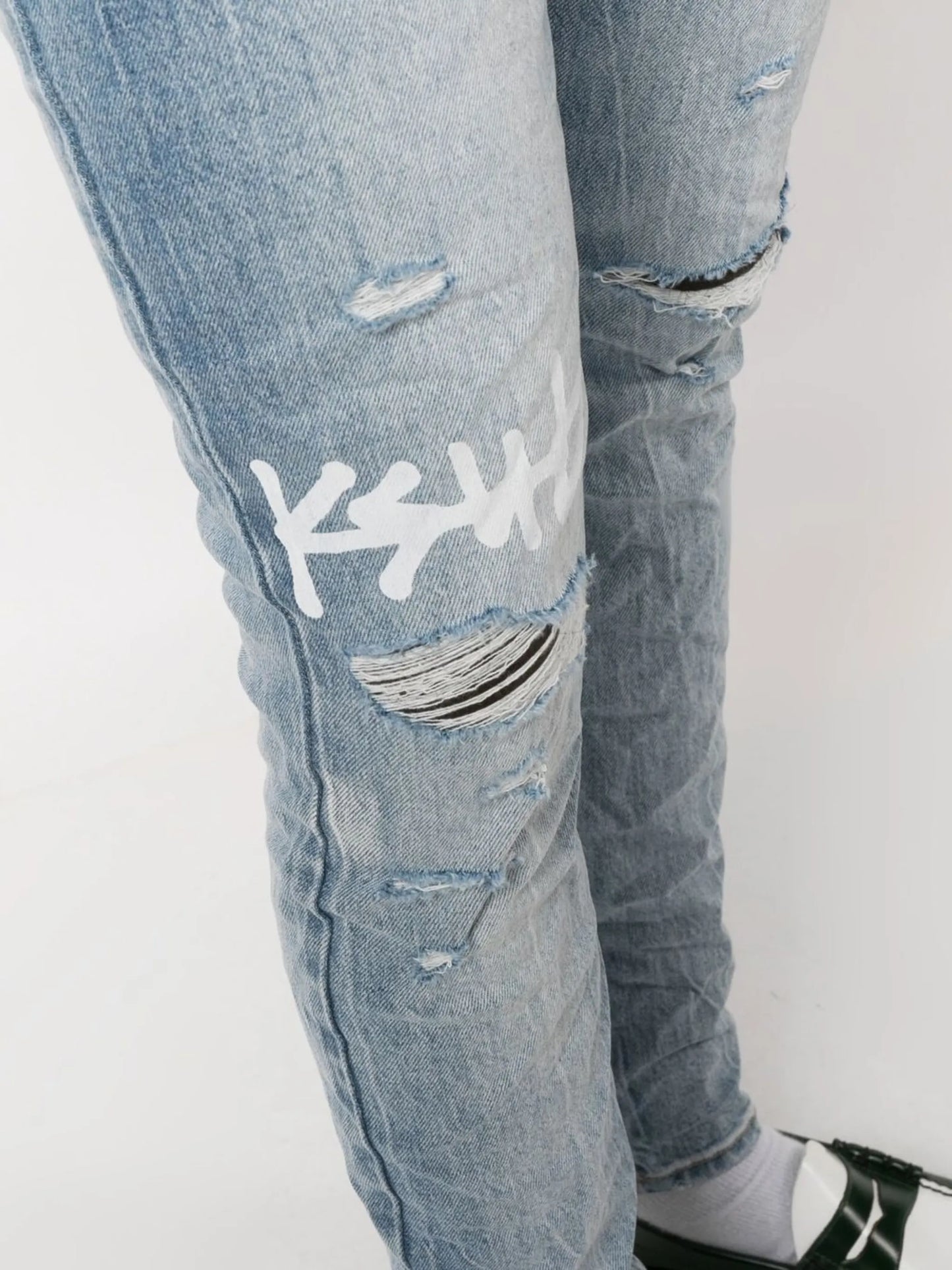 logo-print distressed skinny-cut jeans