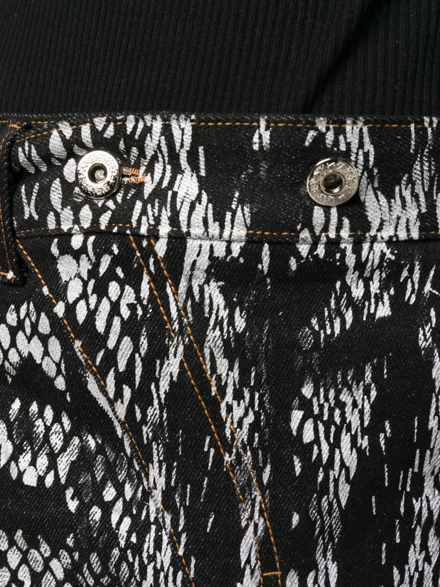 snakeskin-print denim trousers