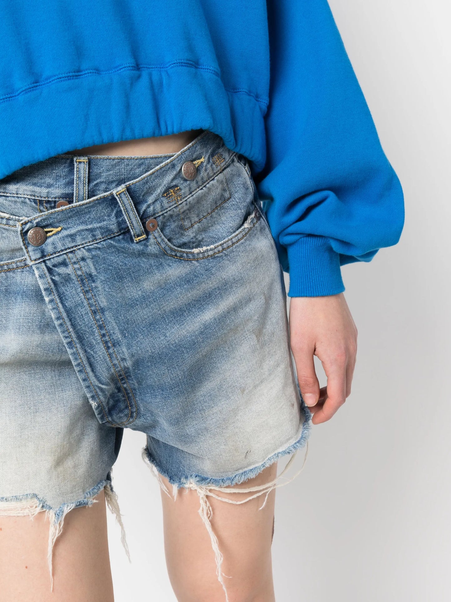 crossover distressed denim shorts