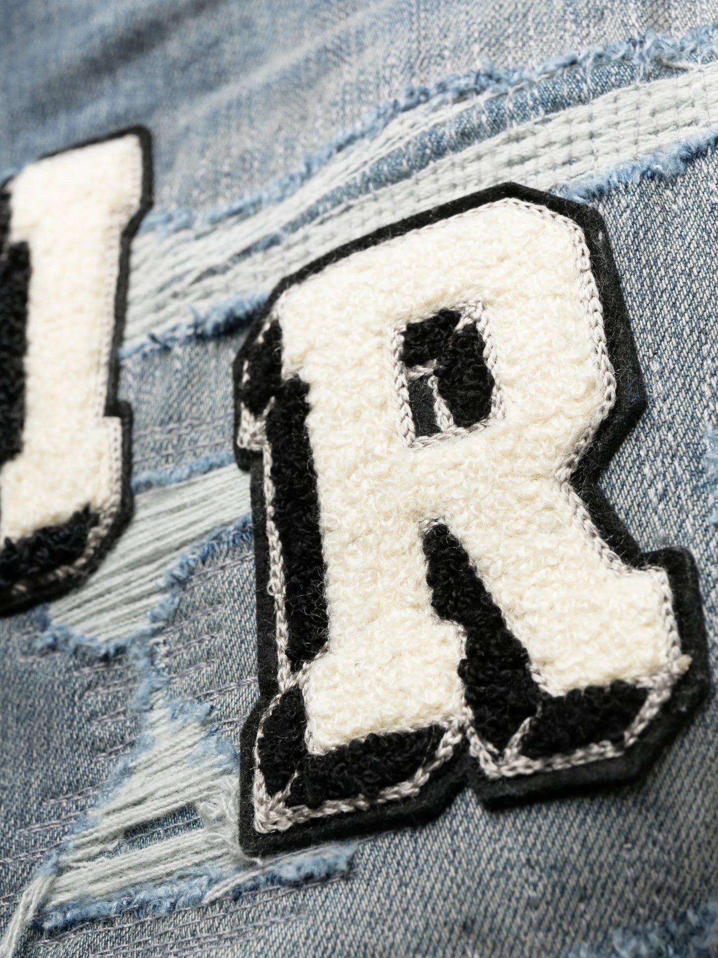 Varsity ripped skinny jeans