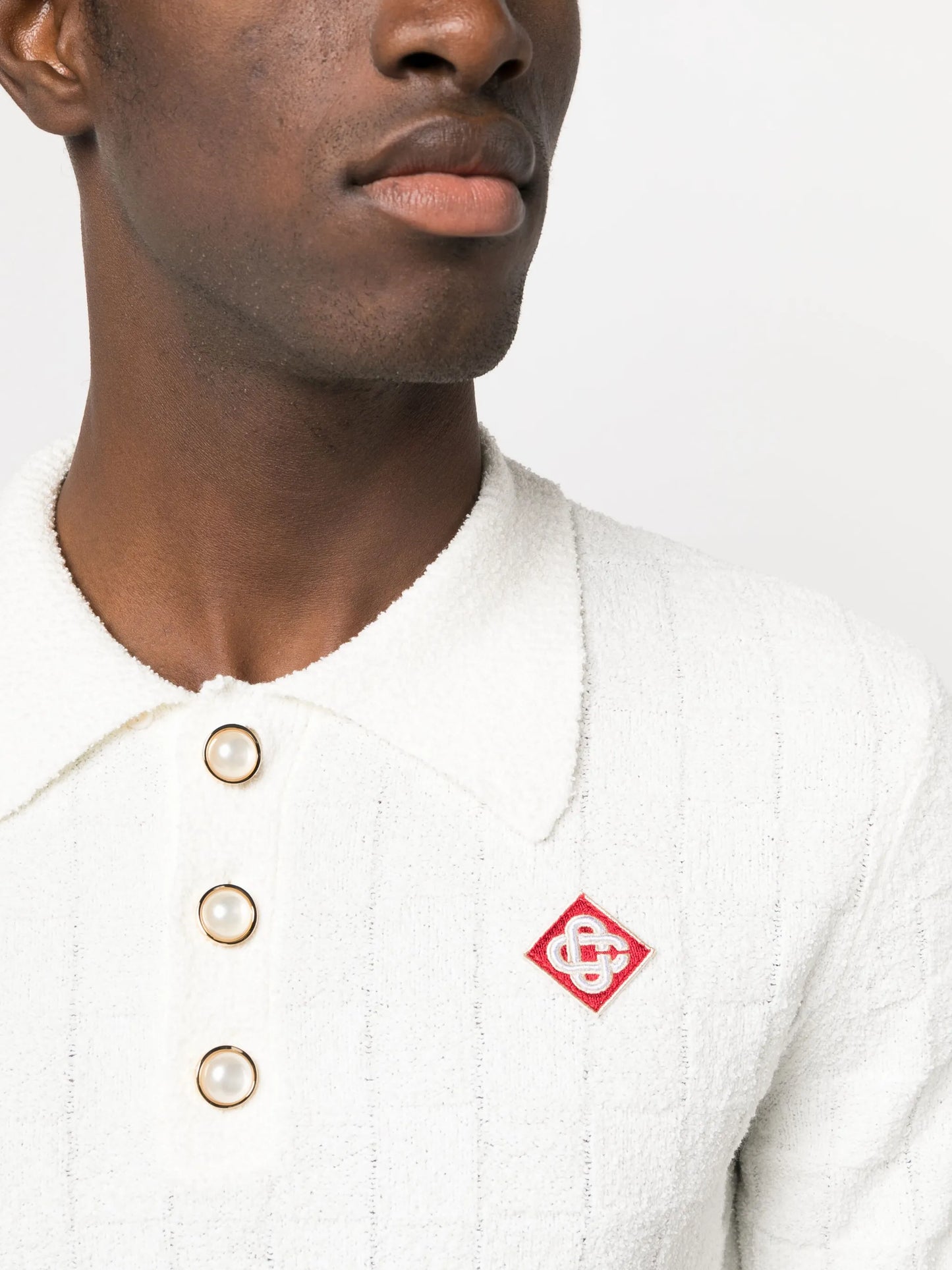 logo-embroidered bouclé polo shirt