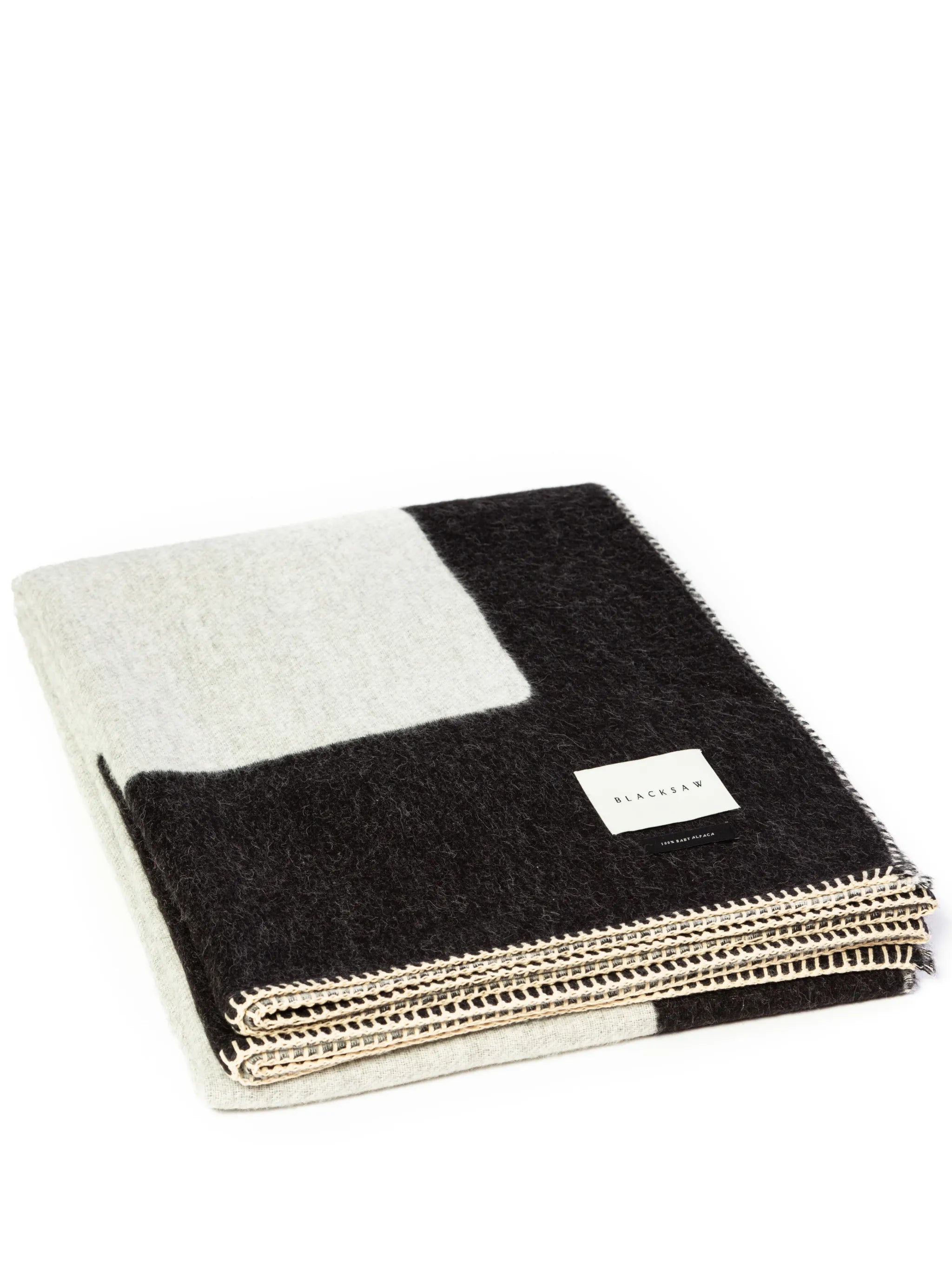 Generation reversible alpaca-wool throw
