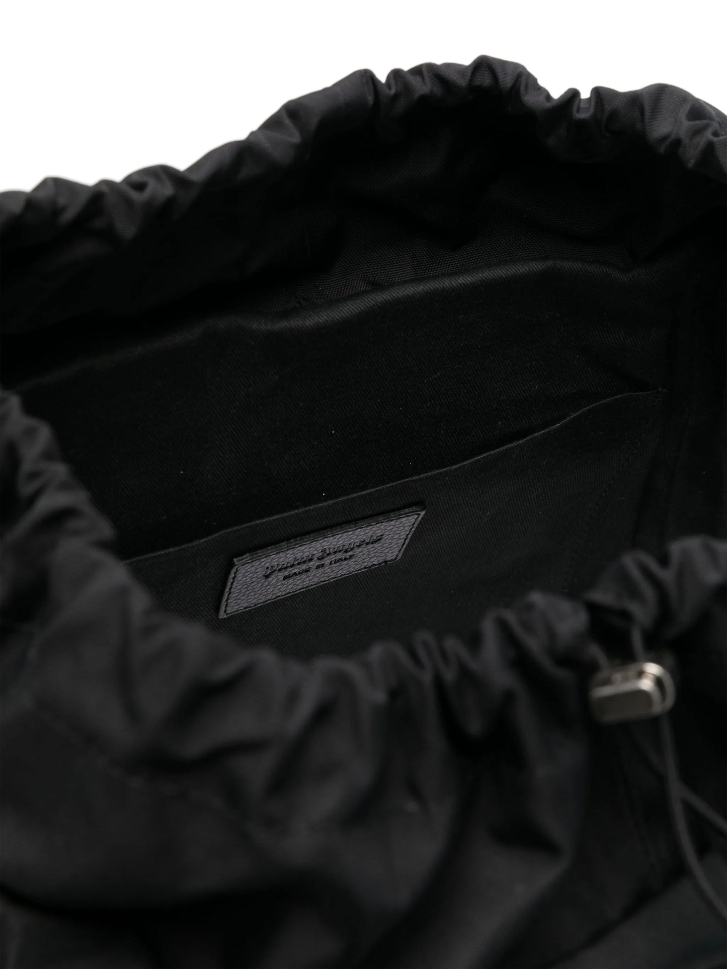 monogram-debossed canvas backpack