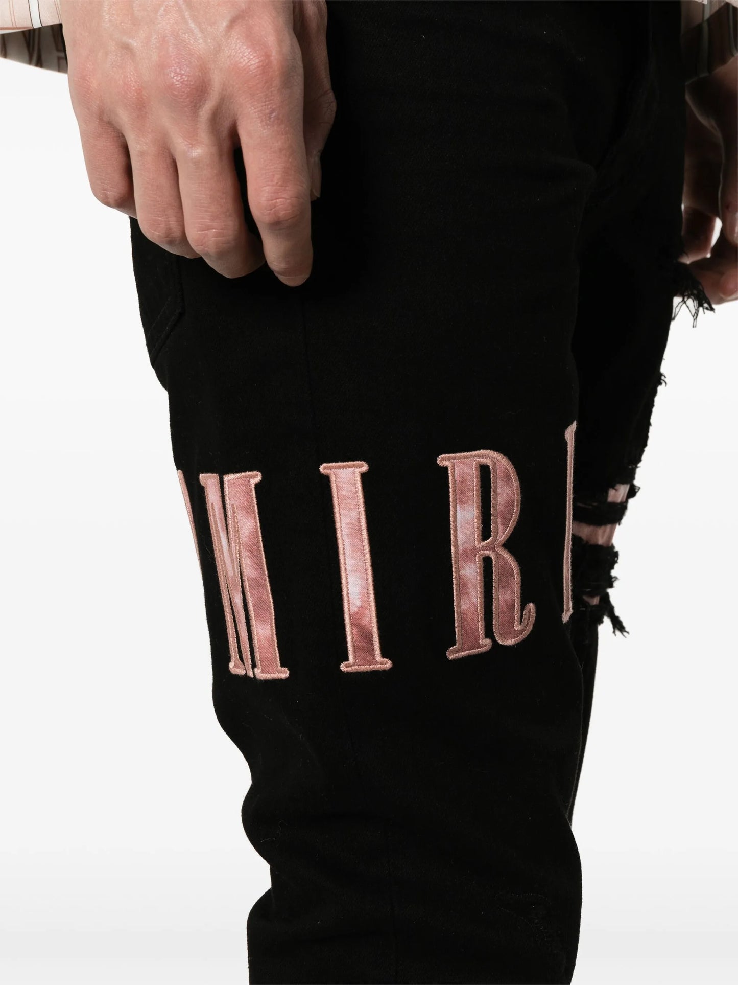 waxed logo-appliqué skinny jeans