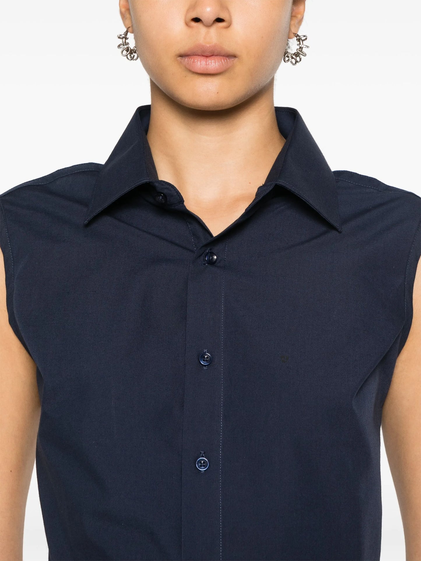 sleeveless open-back shirt