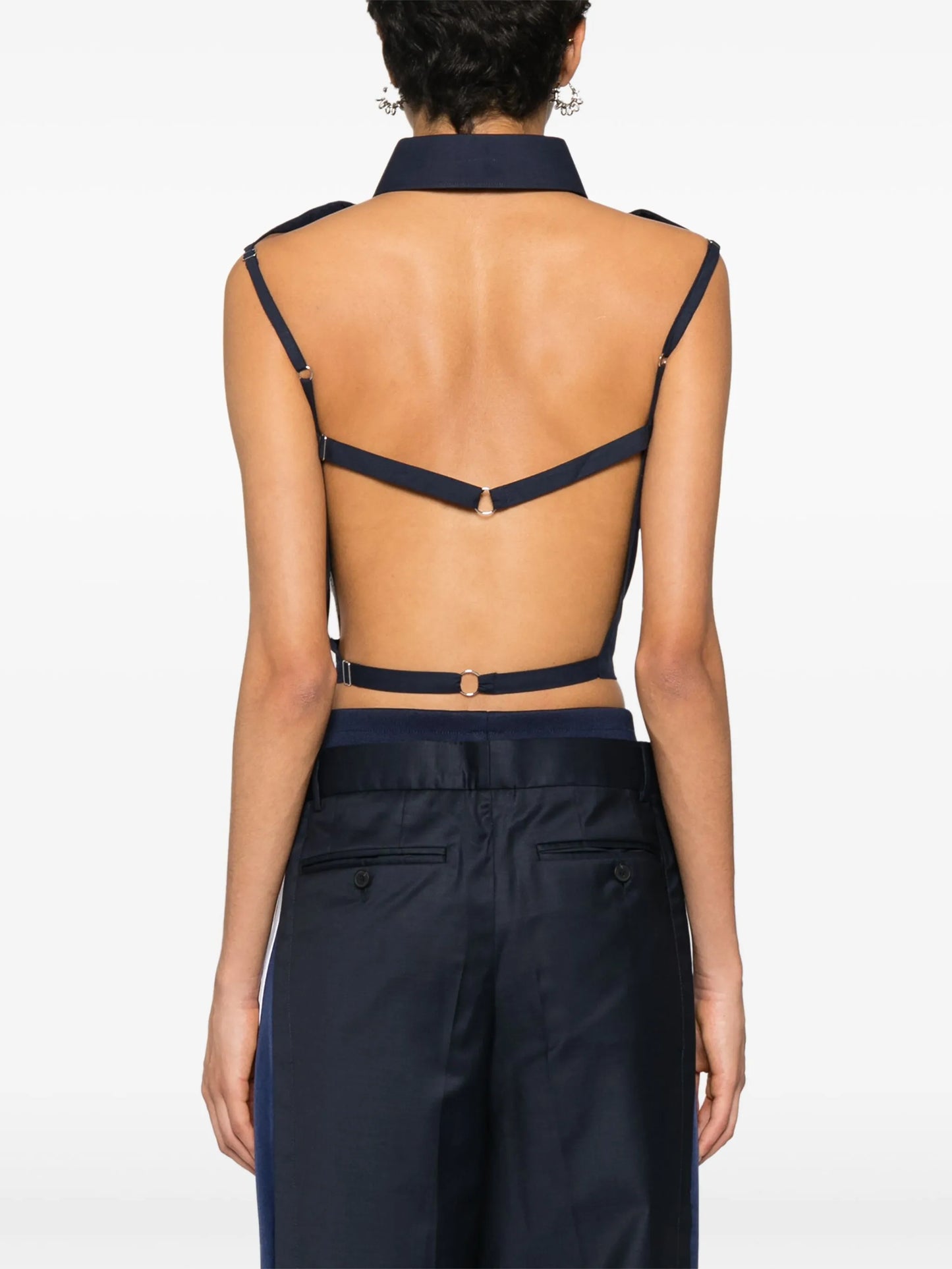 sleeveless open-back shirt