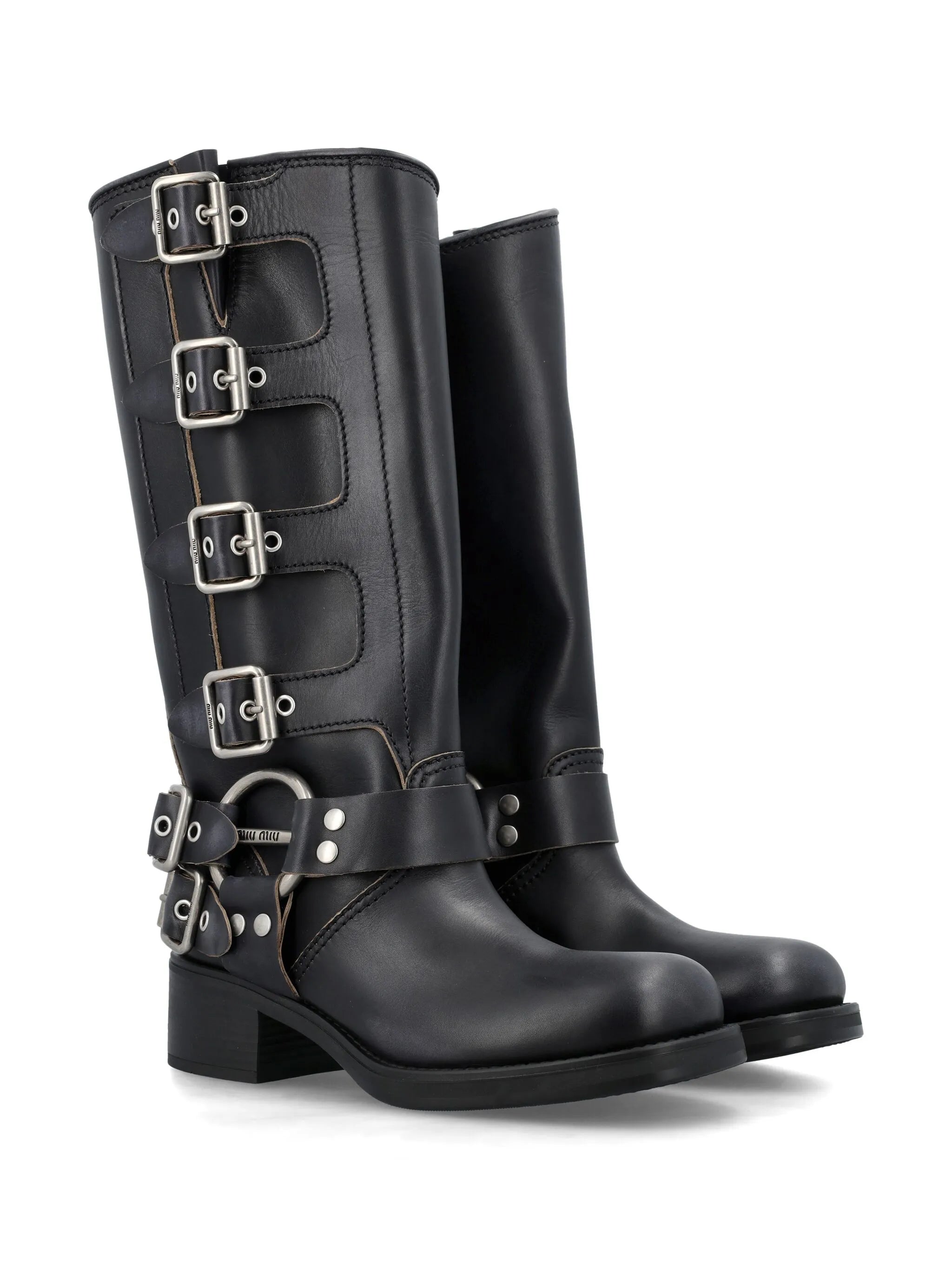 buckled knee-high leather boots