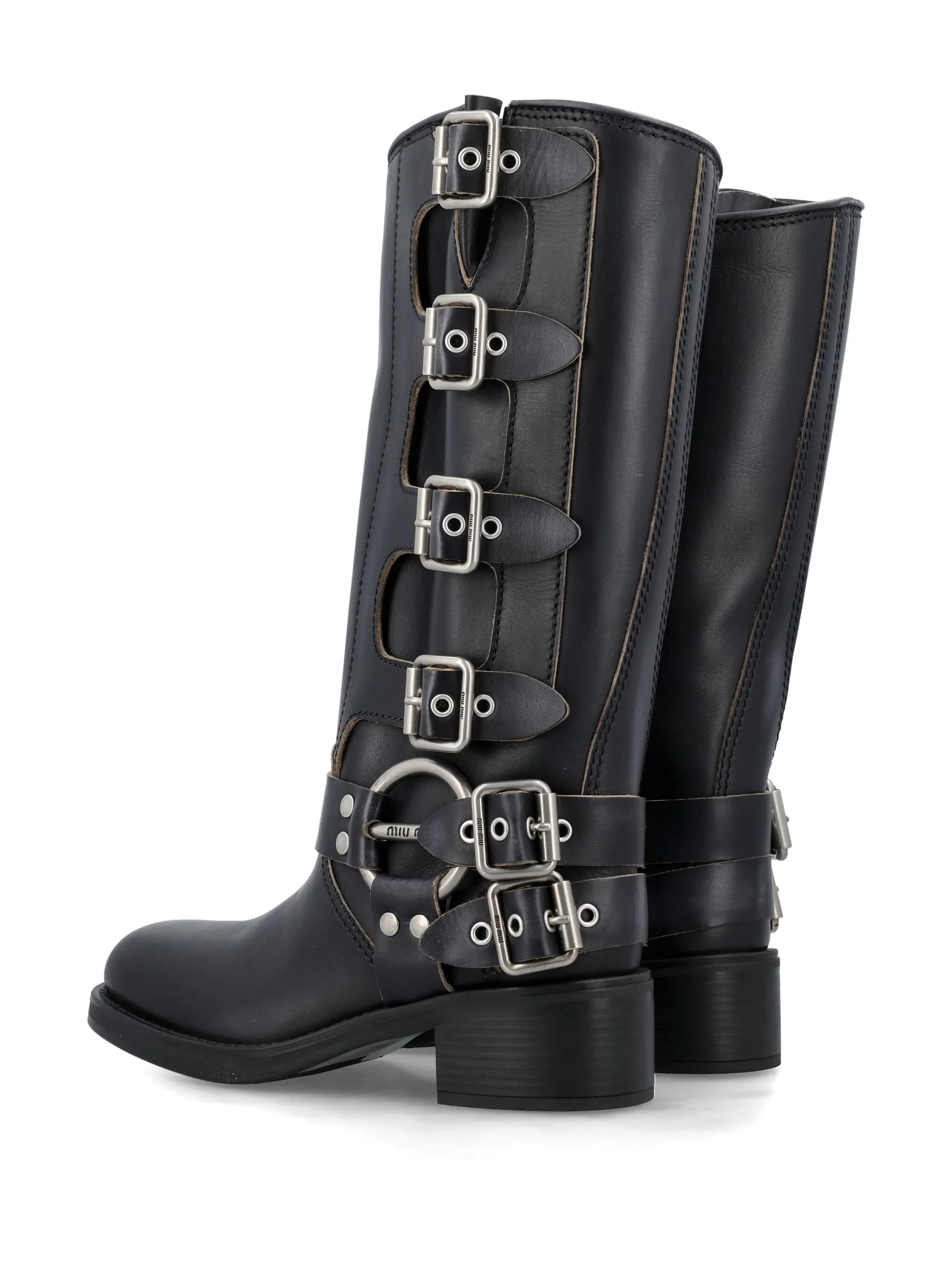 buckled knee-high leather boots