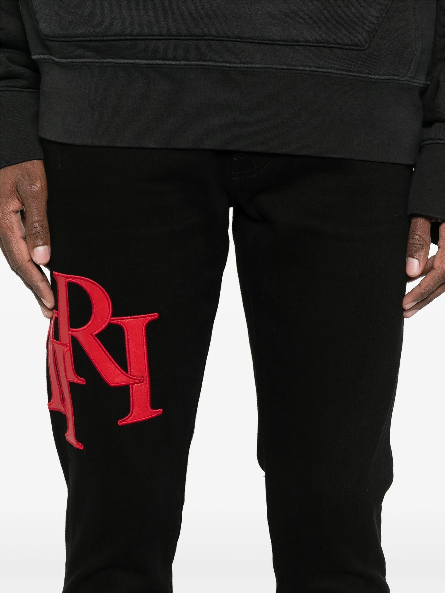 Staggered-logo-embroidered jeans
