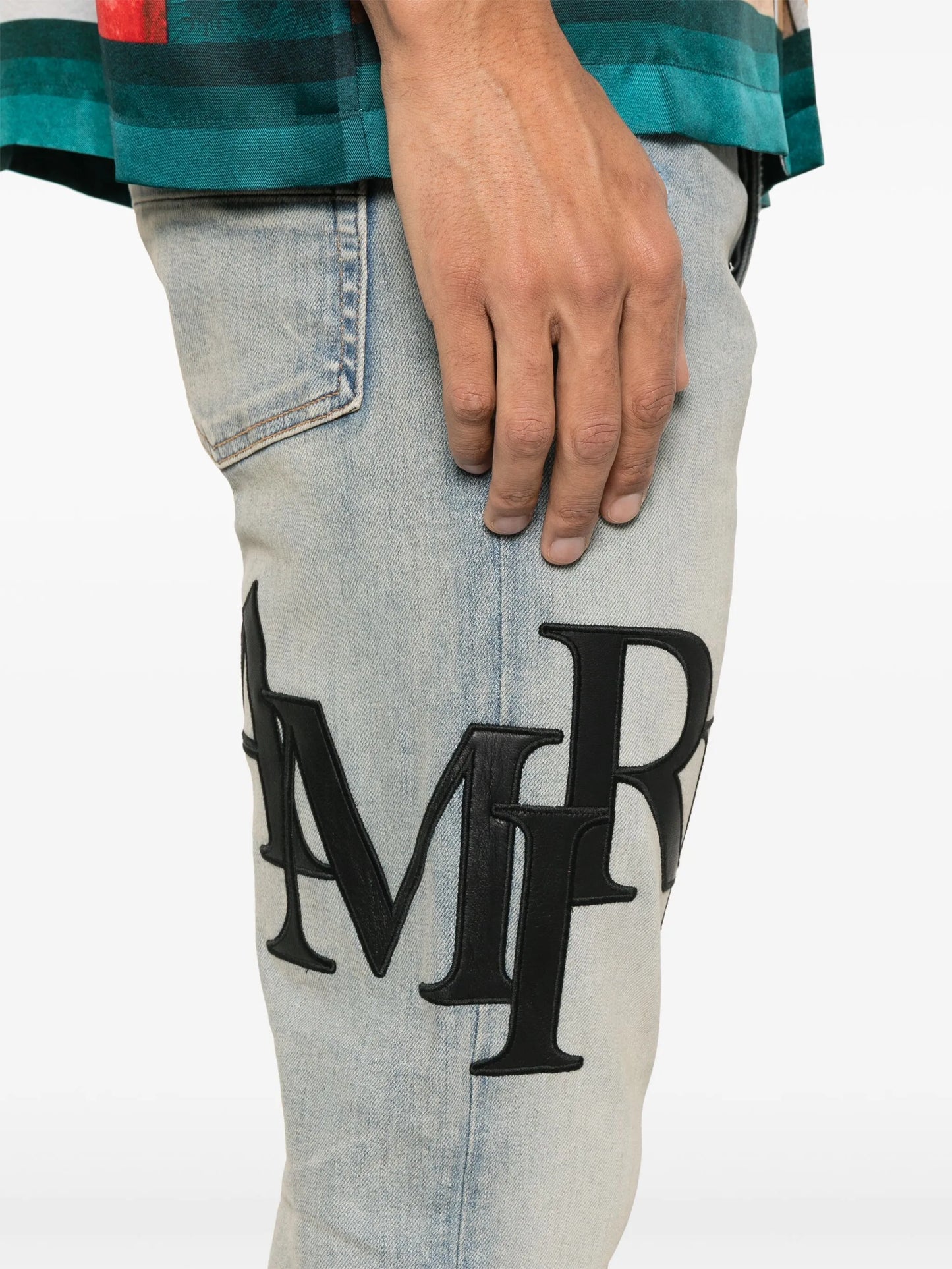 Staggered logo skinny jeans