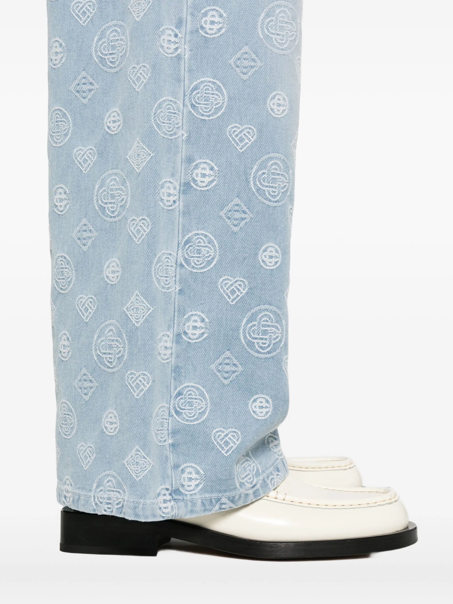 monogram-pattern jeans