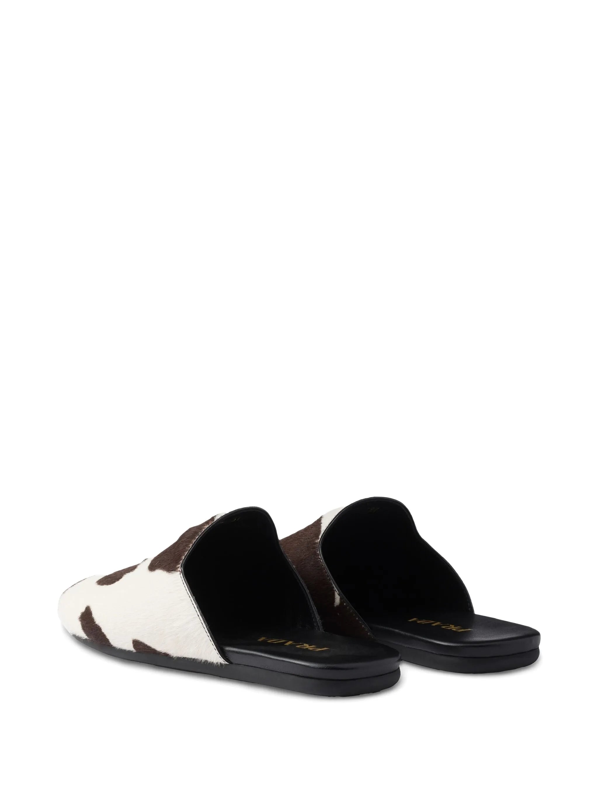 cow-print slip-on mules