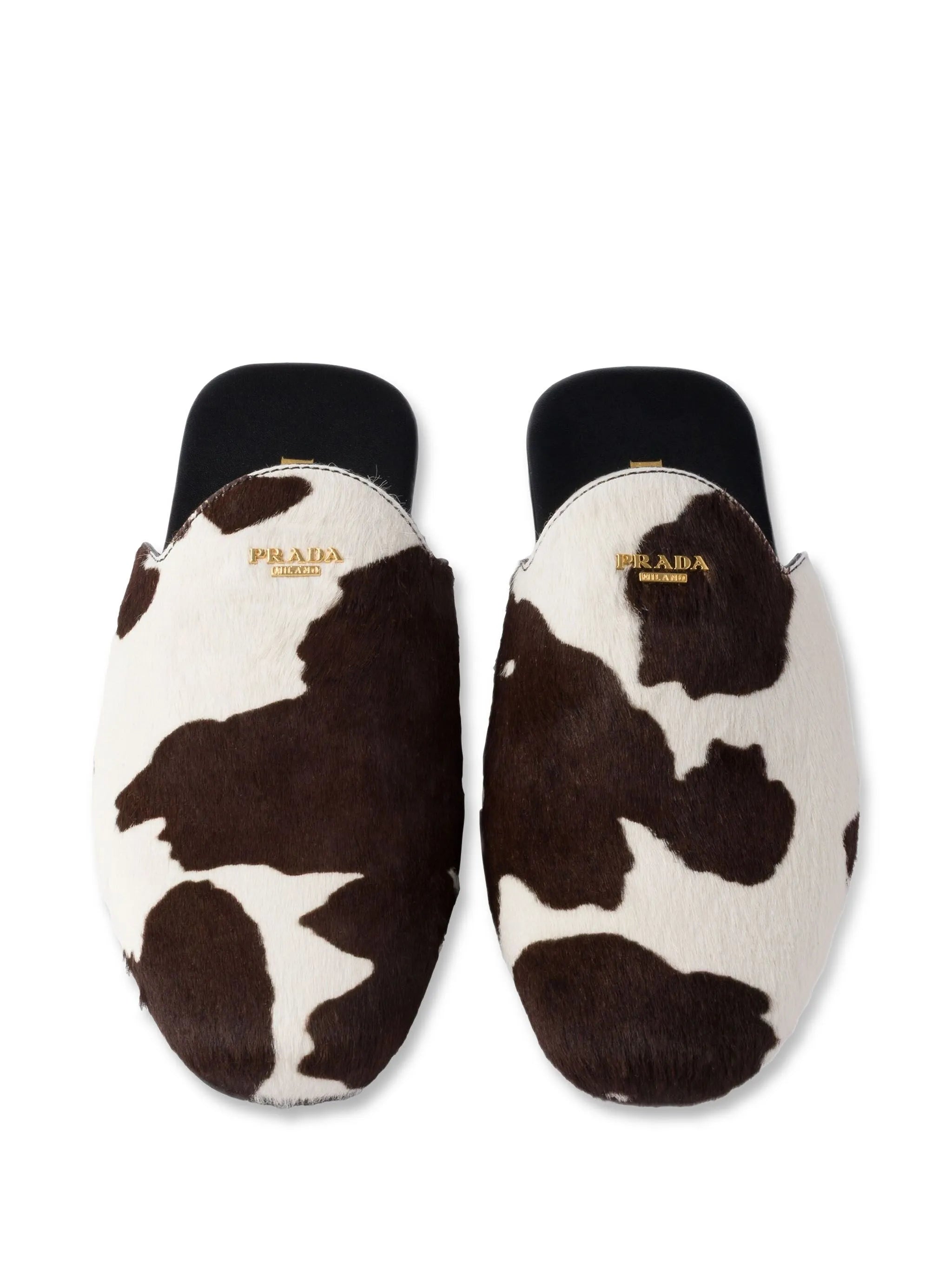 cow-print slip-on mules