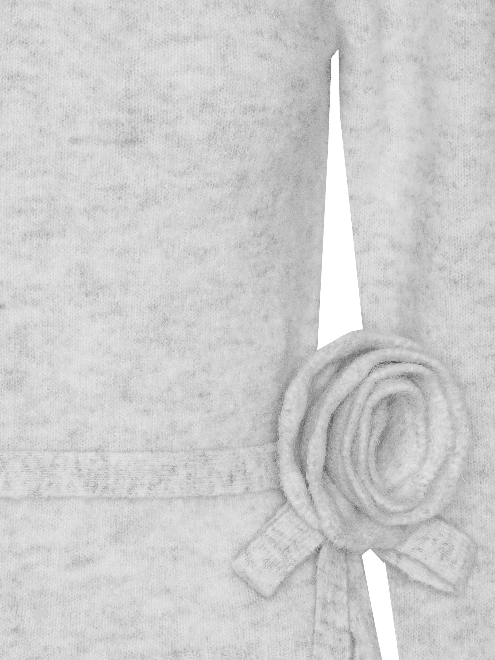 rose-embellished top