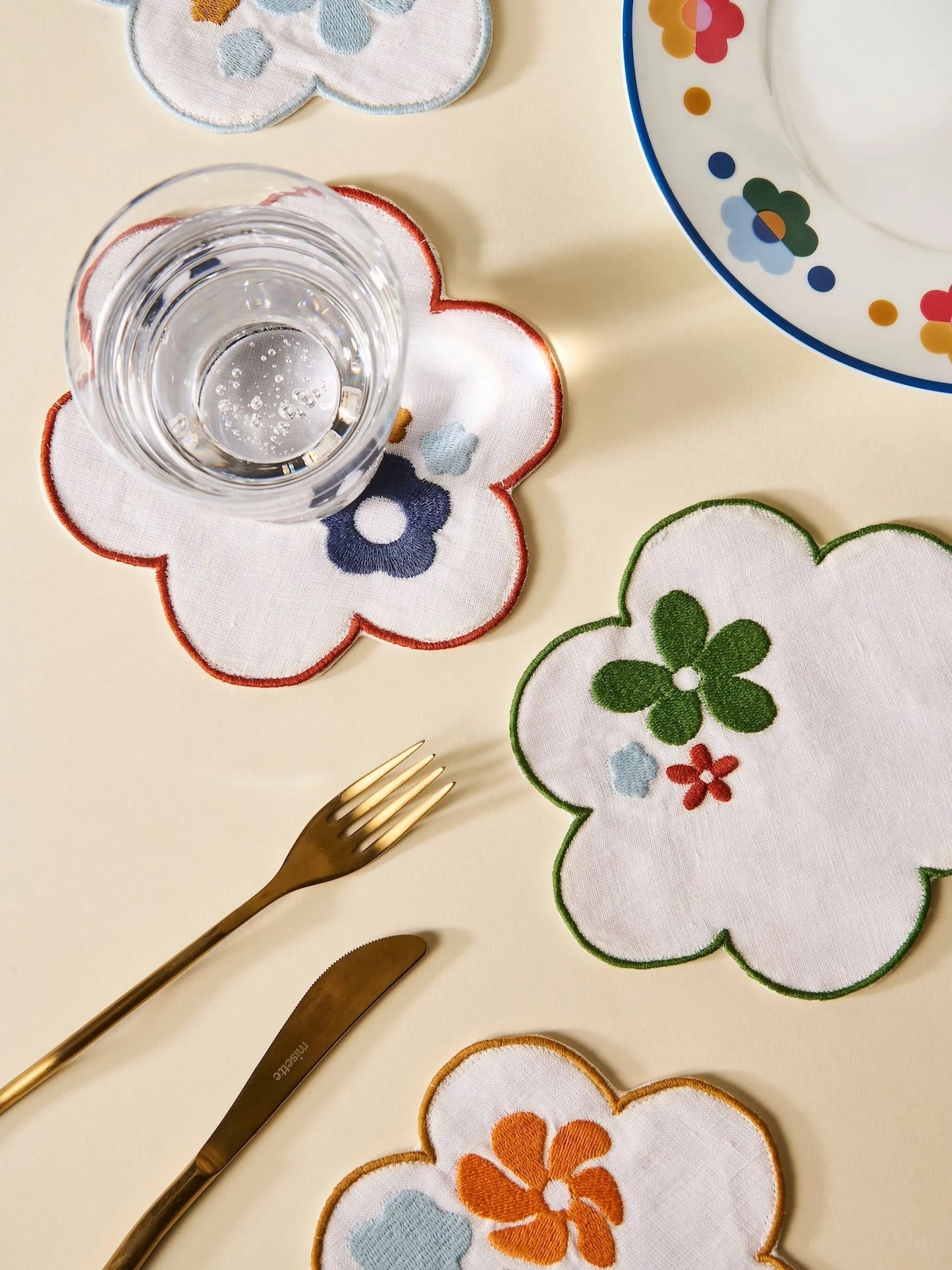 flower-shaped embroidered linen coasters (set of four)
