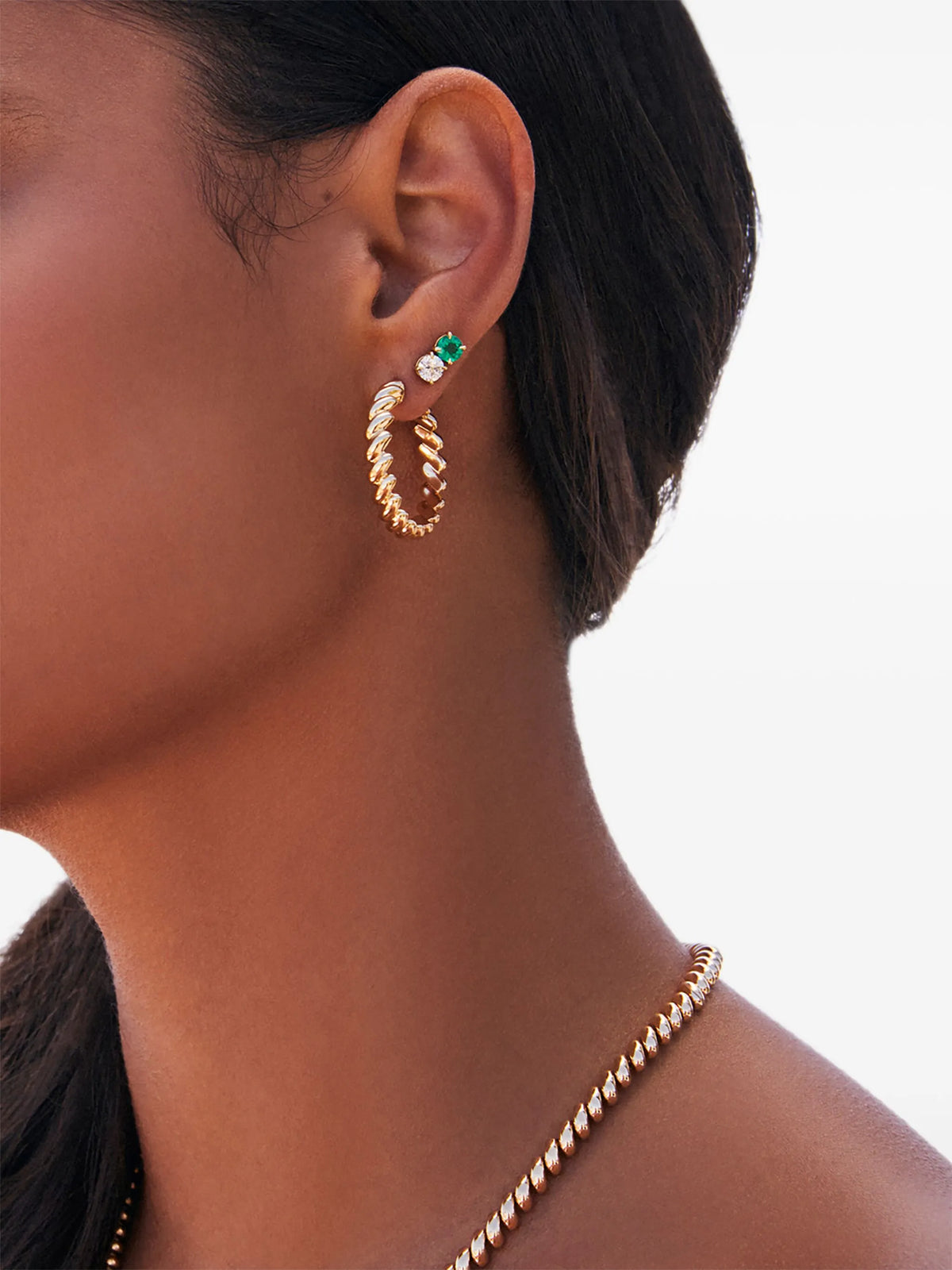 round emerald and diamond studs