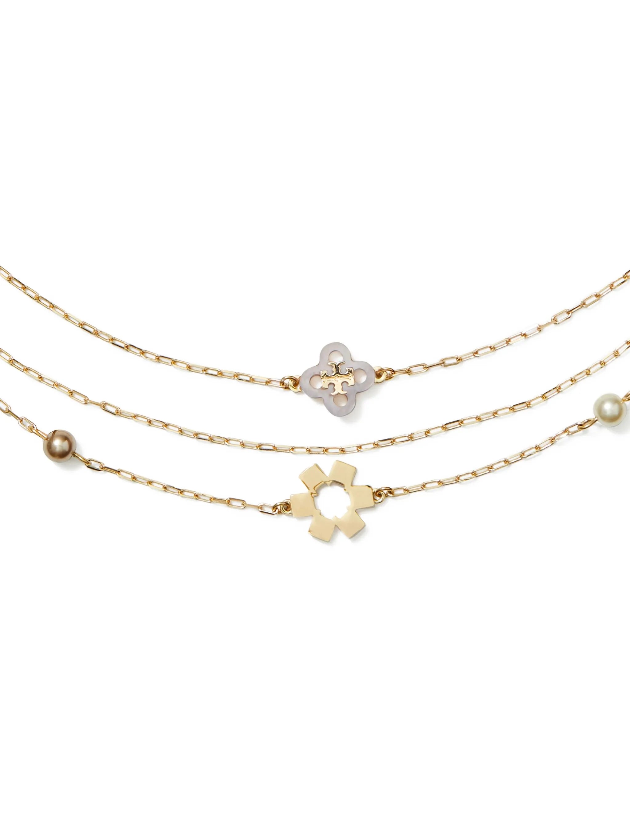triple-strand flower-charm necklace