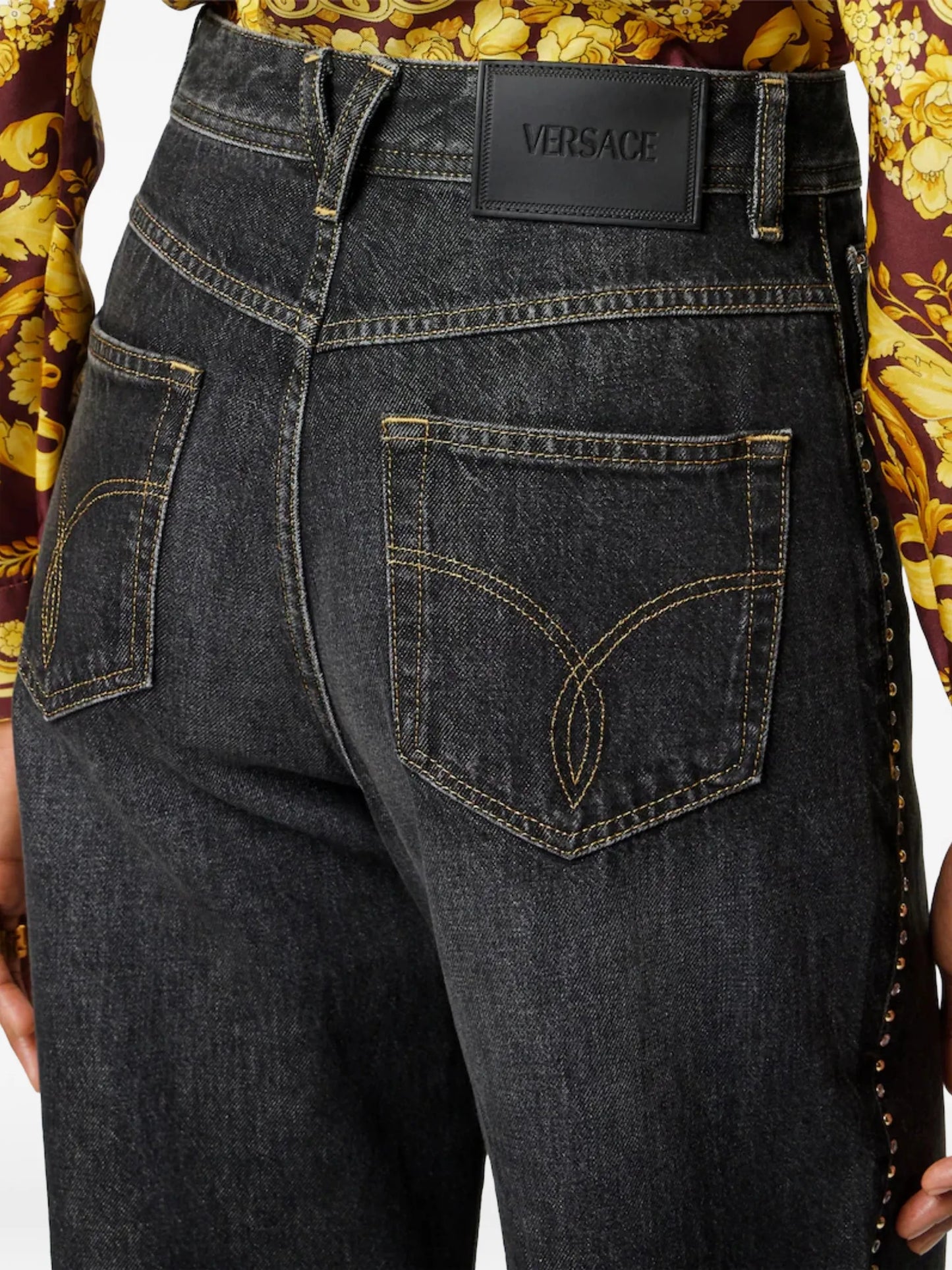 studded high-waist denim trousers