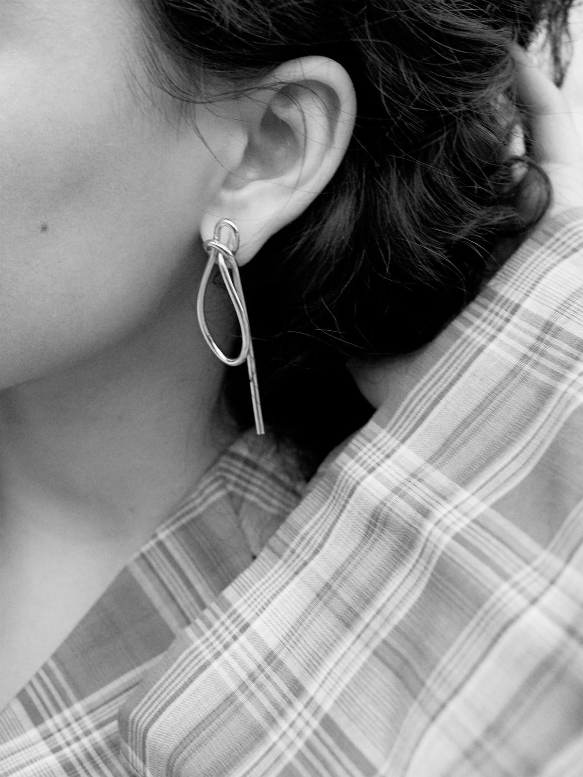 Thread asymmetrical knot earrings