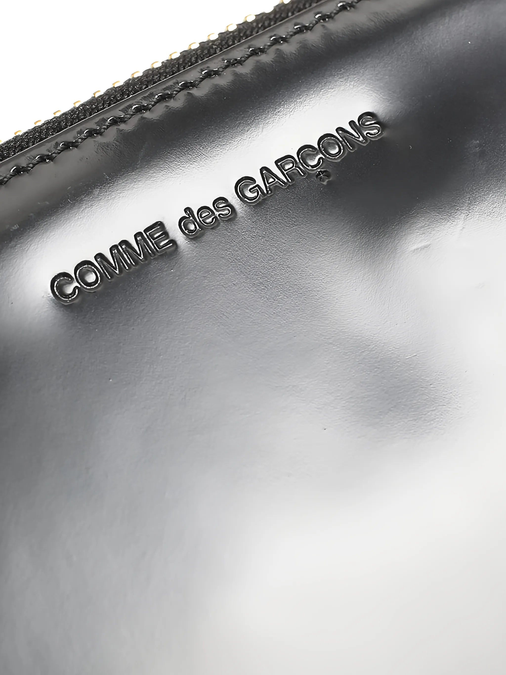 logo-debossed leather clutch