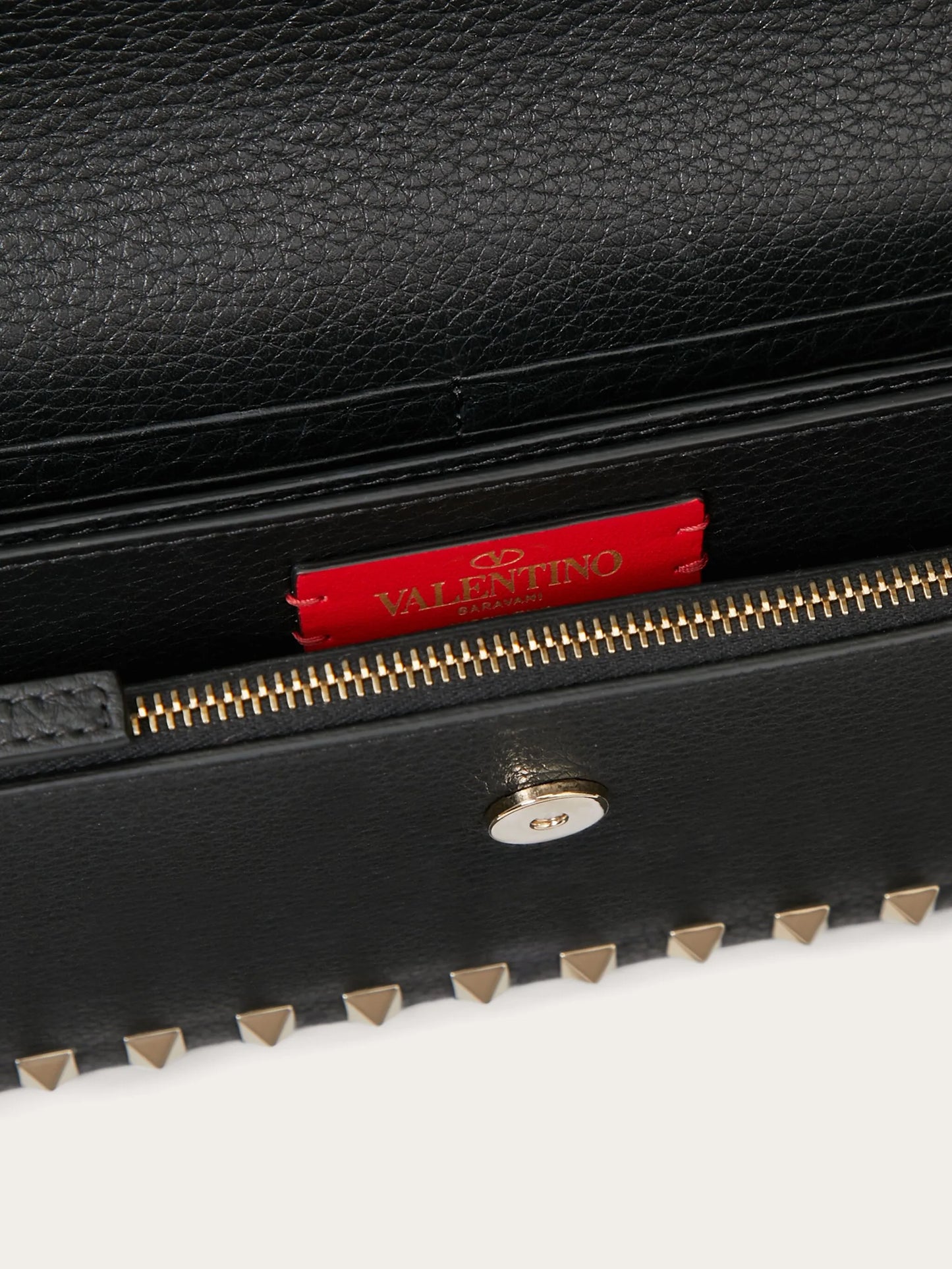 Rockstud leather clutch bag