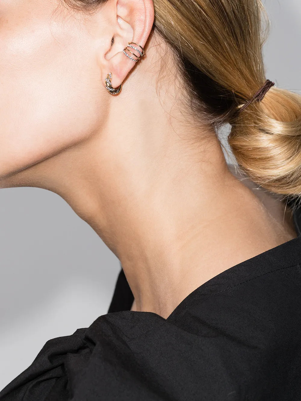 pair of twisted diamond hoop earrings in yellow gold