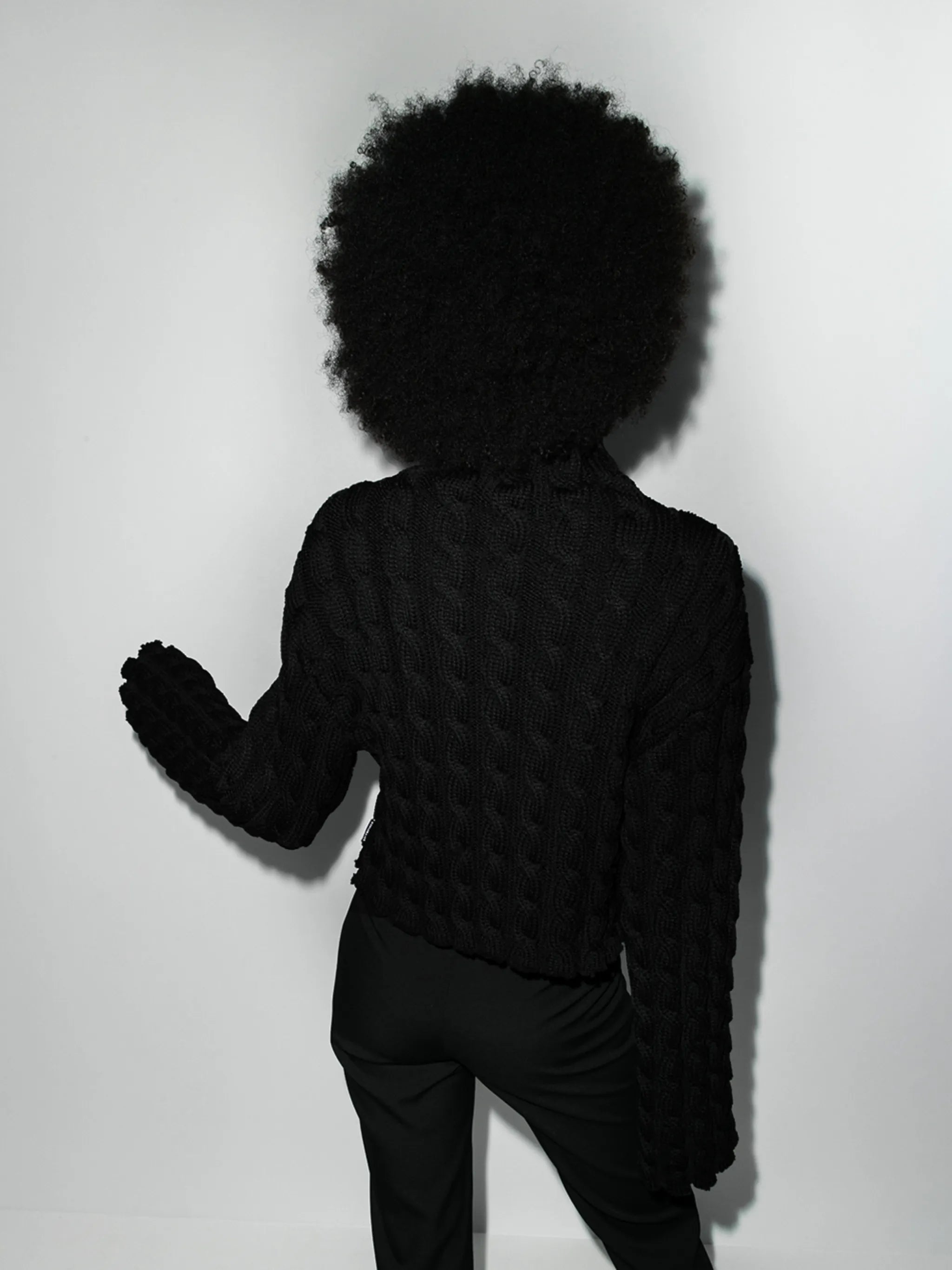 high-neck cable-knit jumper