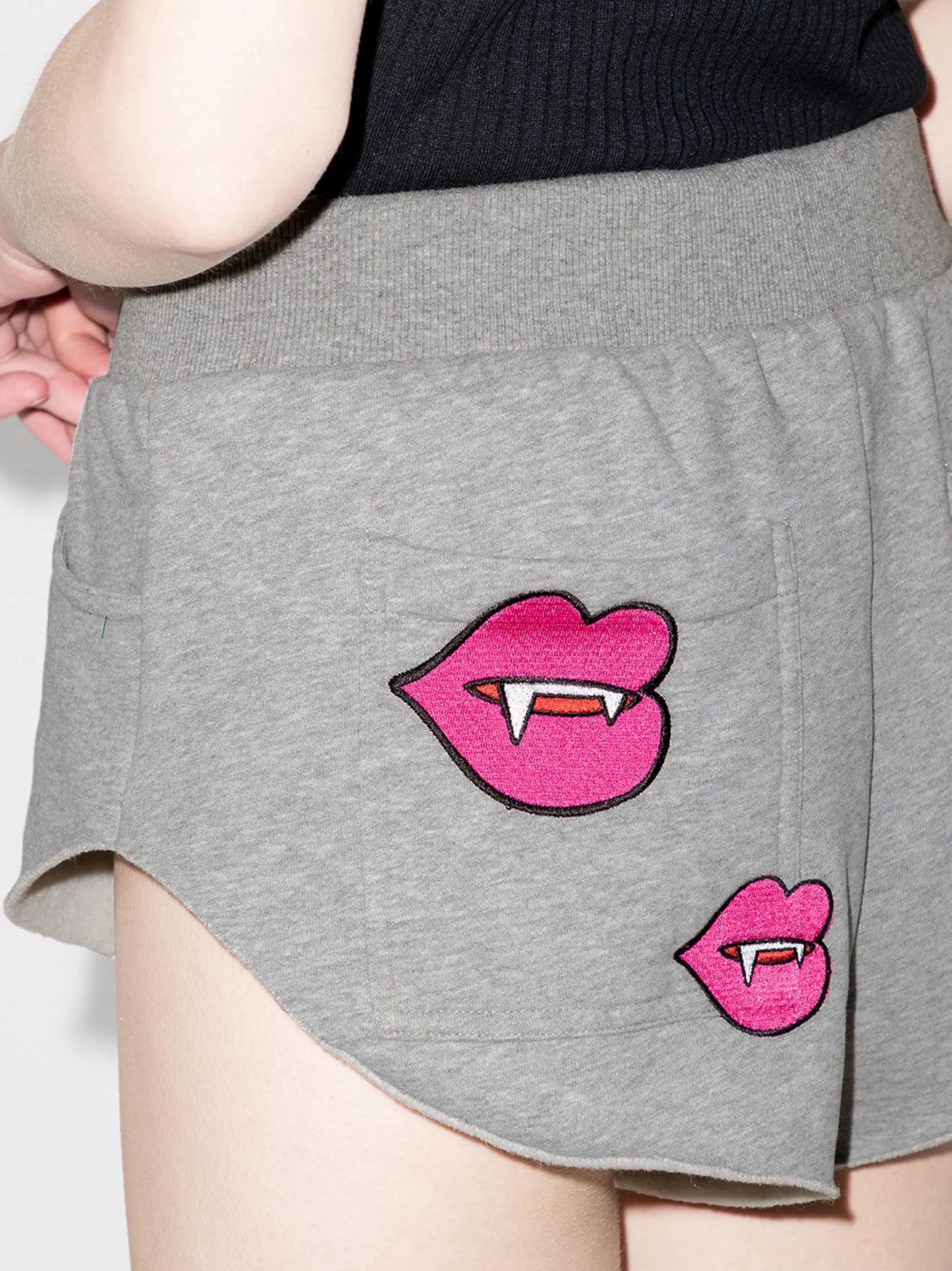 patch-detailing track shorts