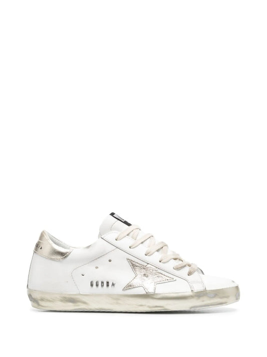 Super-Star trainers with gold sparkle foxing and metal stud lettering