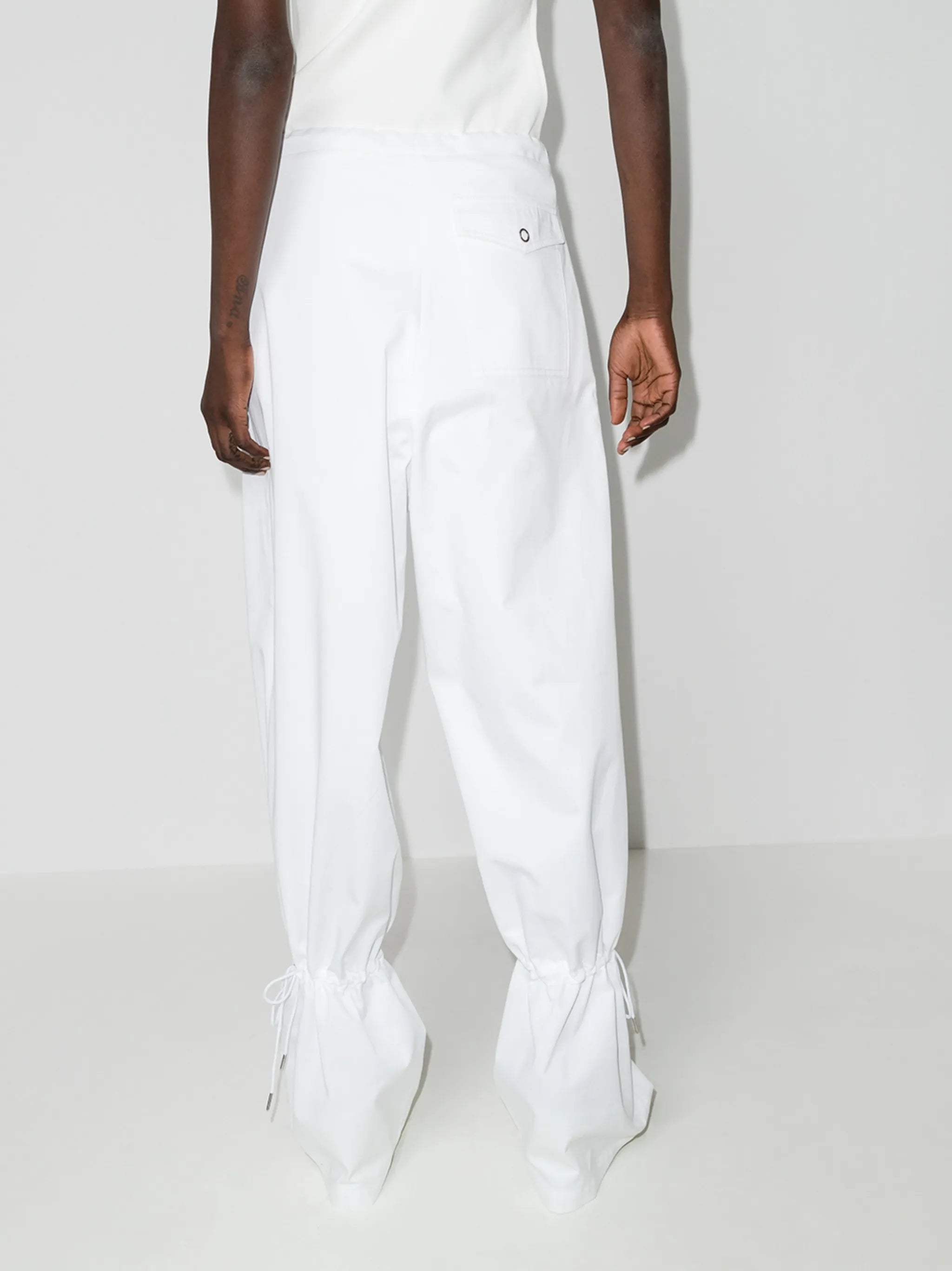 Eyelet tie-cuff flared trousers