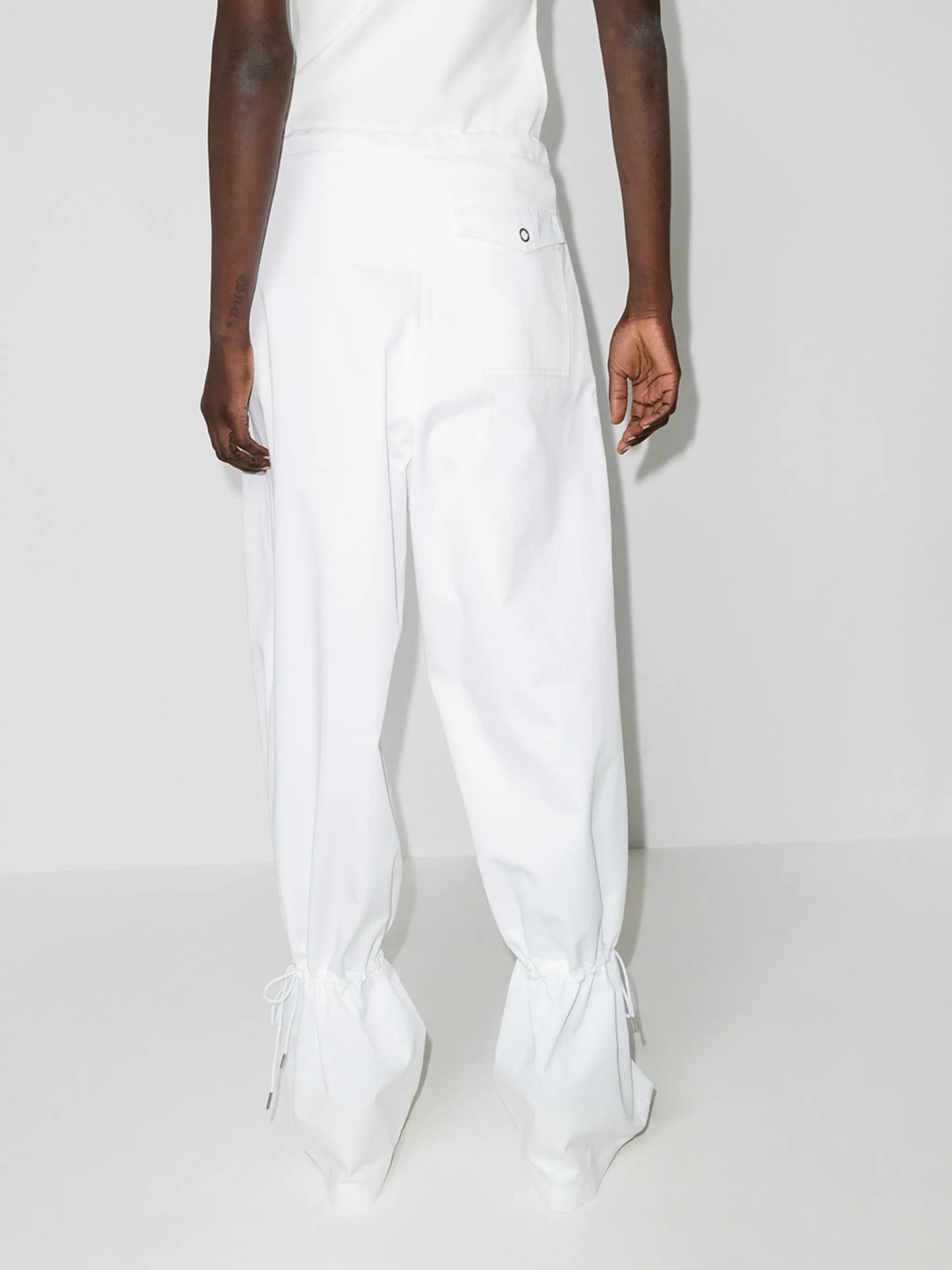 Eyelet tie-cuff flared trousers