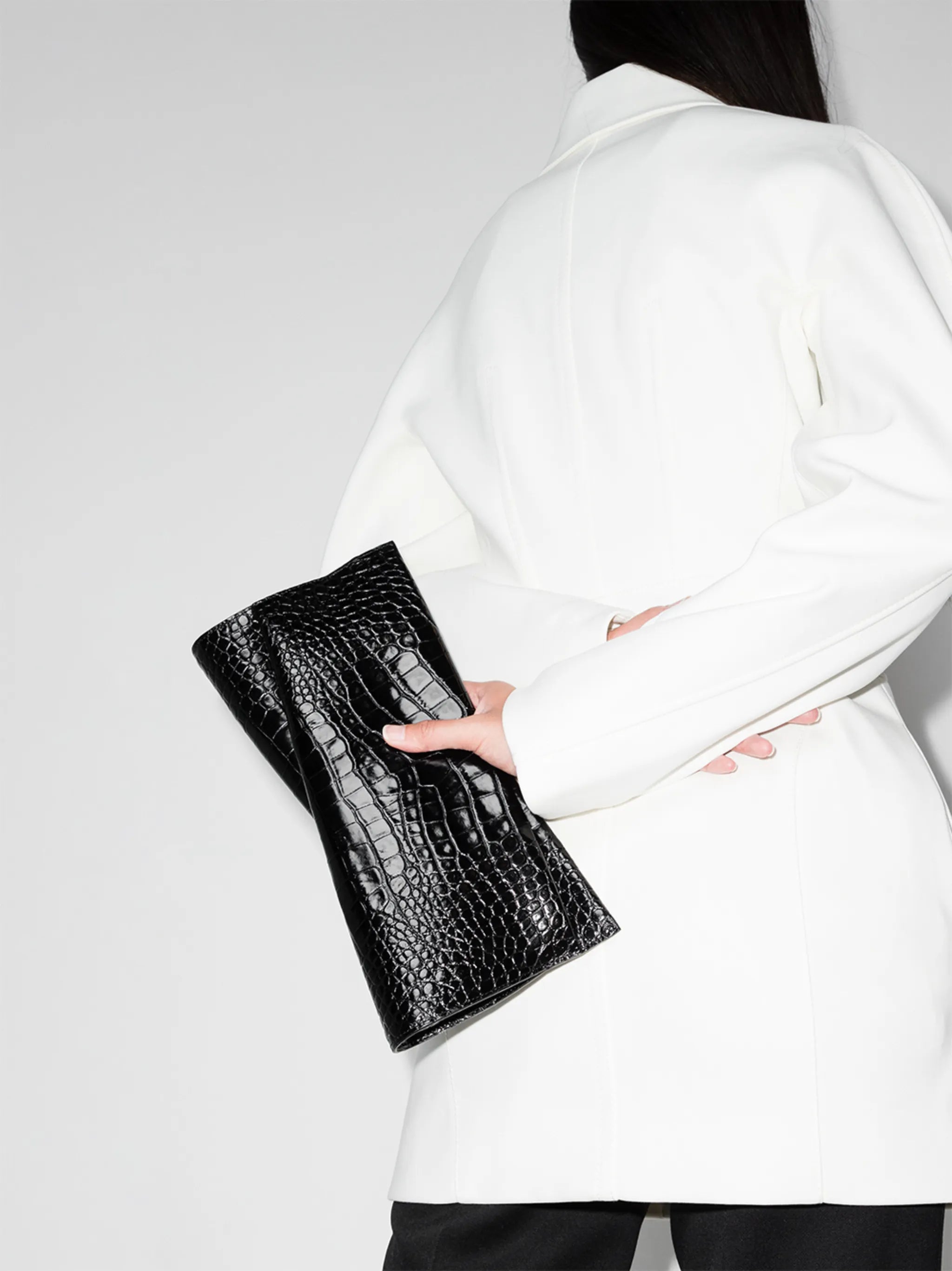 Loubi crocodile-effect clutch bag