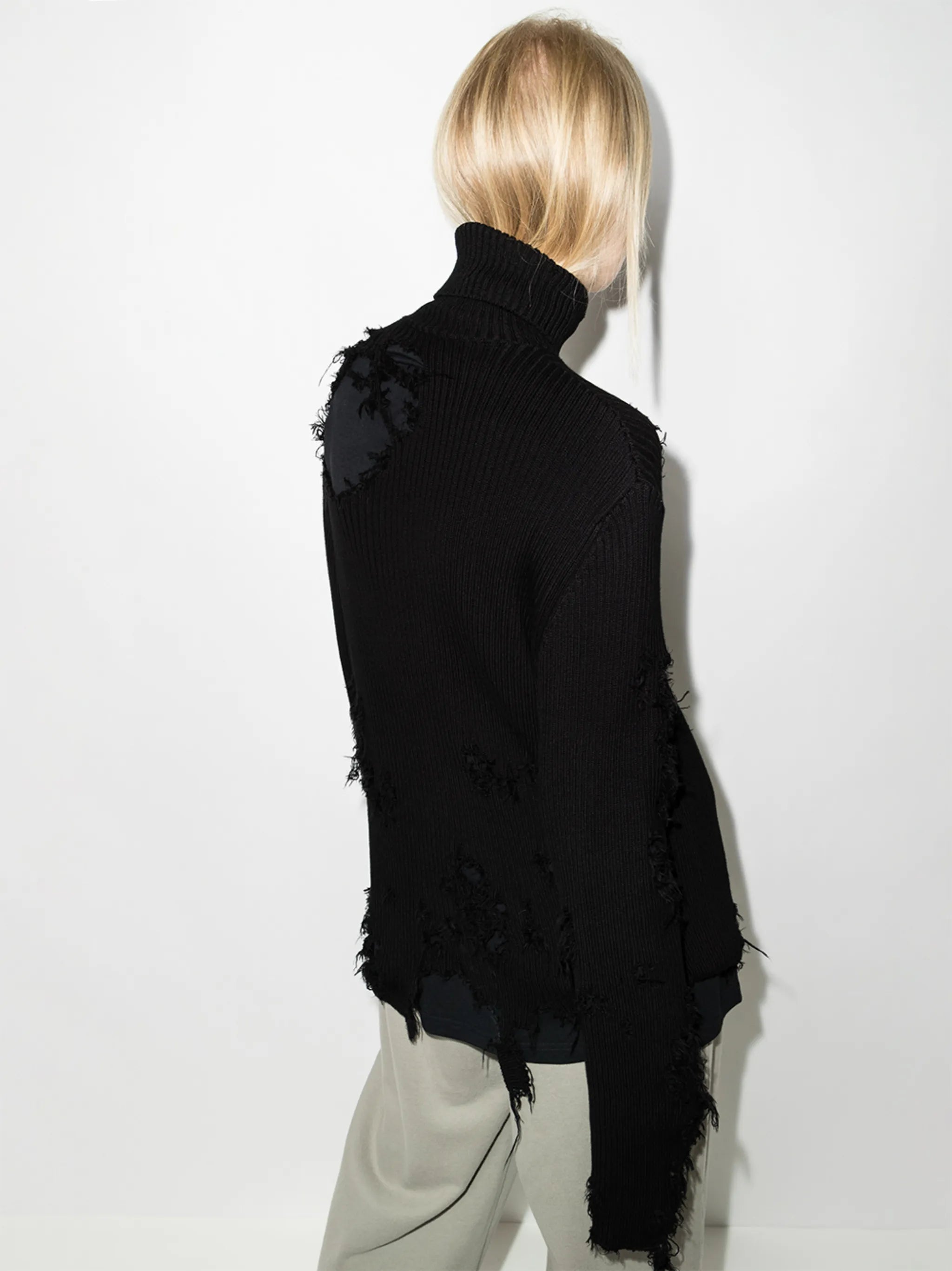 Destroyed ripped roll neck jumper