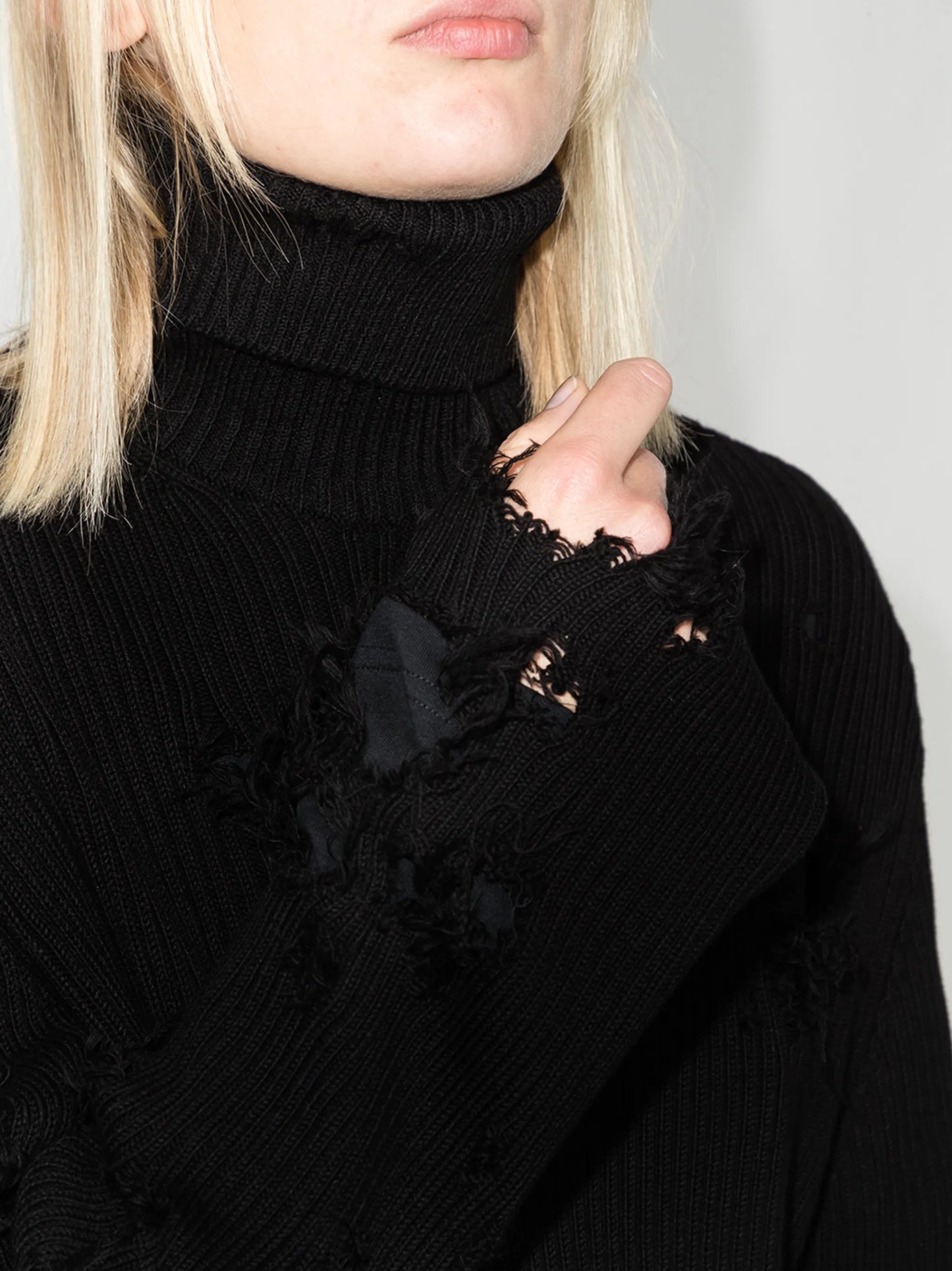 Destroyed ripped roll neck jumper