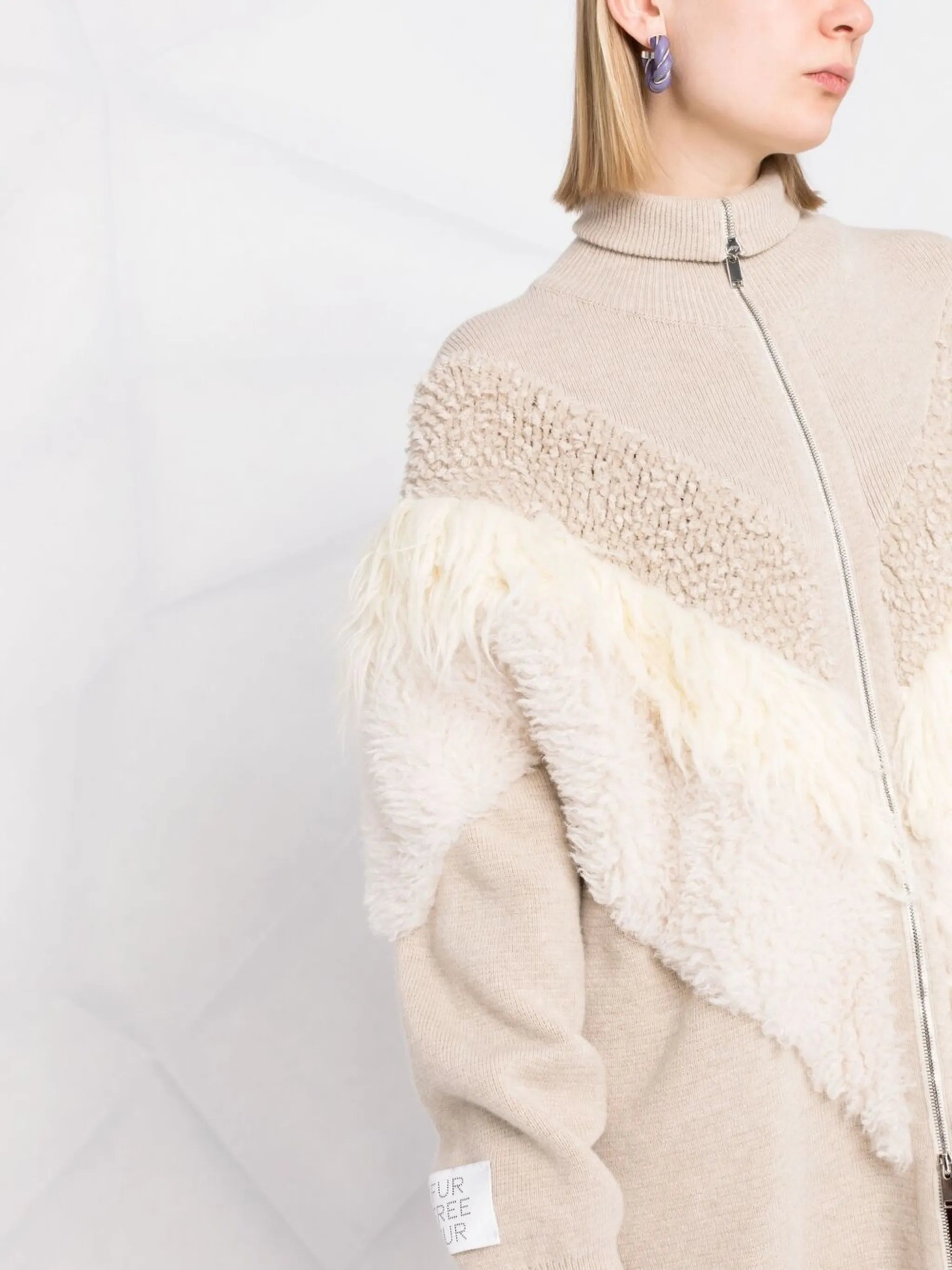 textured-panel knitted coat