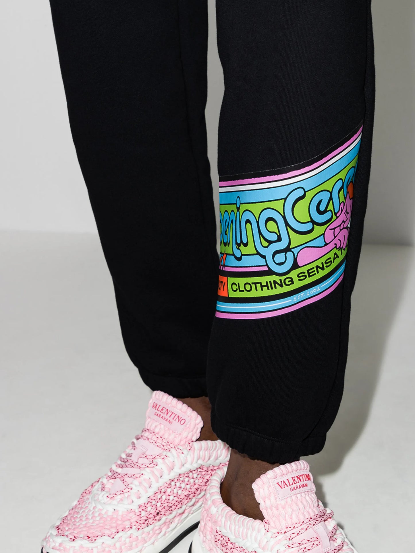 cartoon-print band track pants