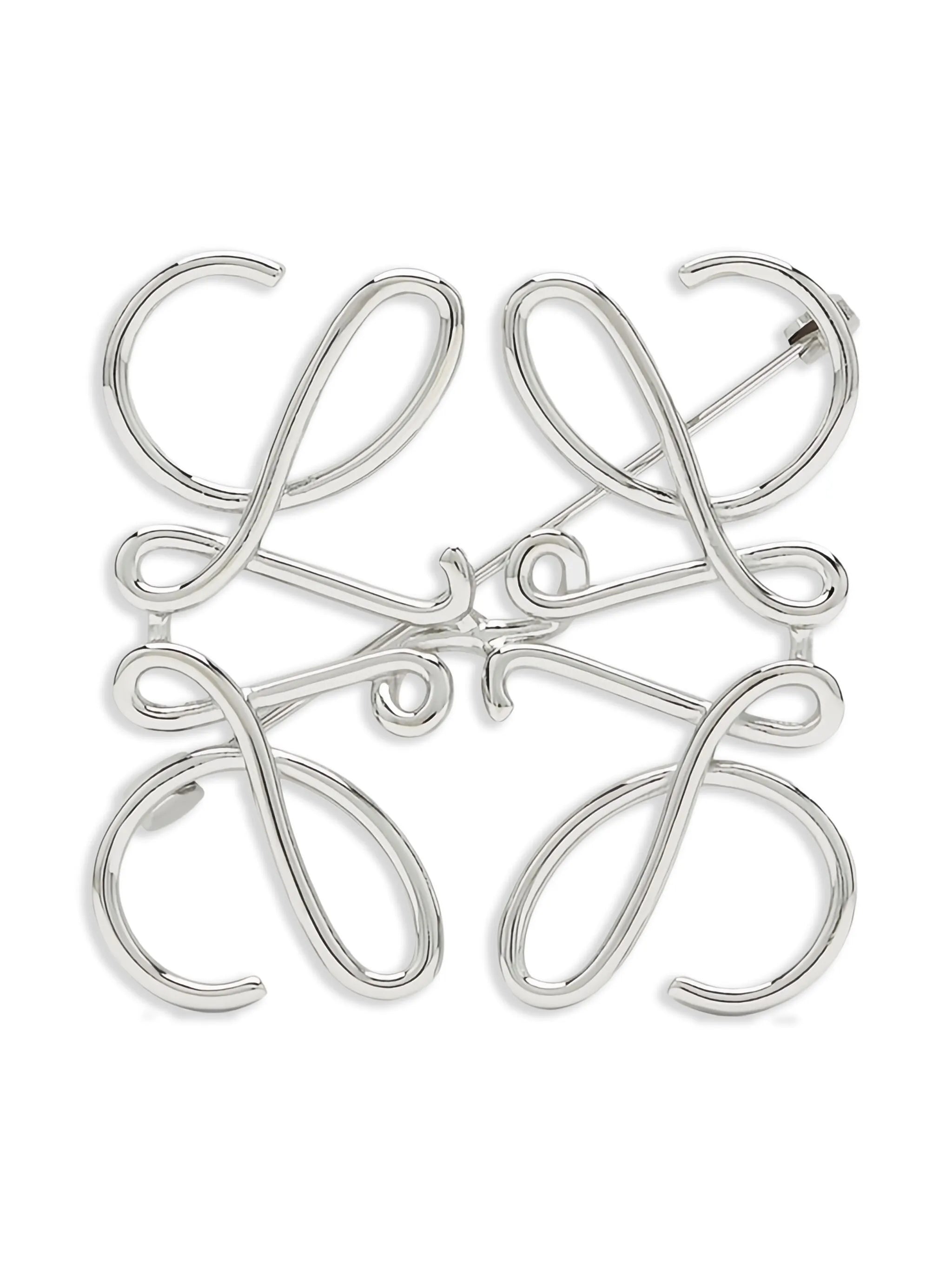 Anagram metal brooch