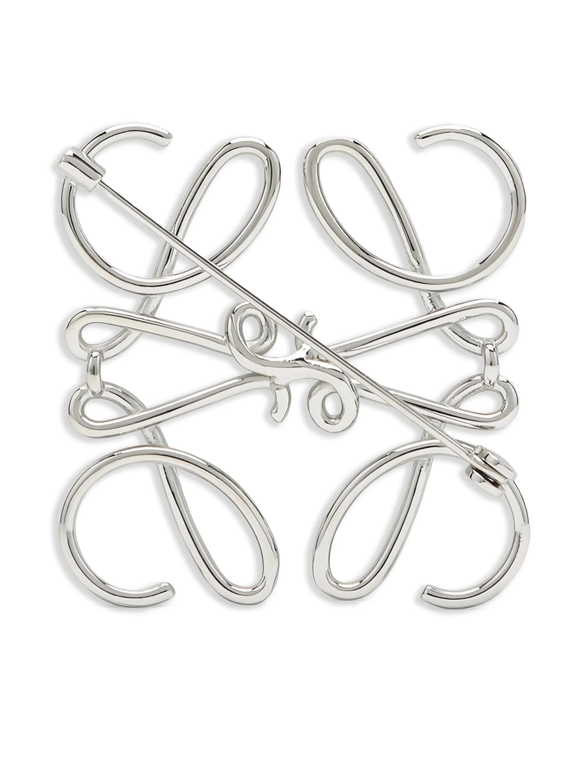 Anagram metal brooch