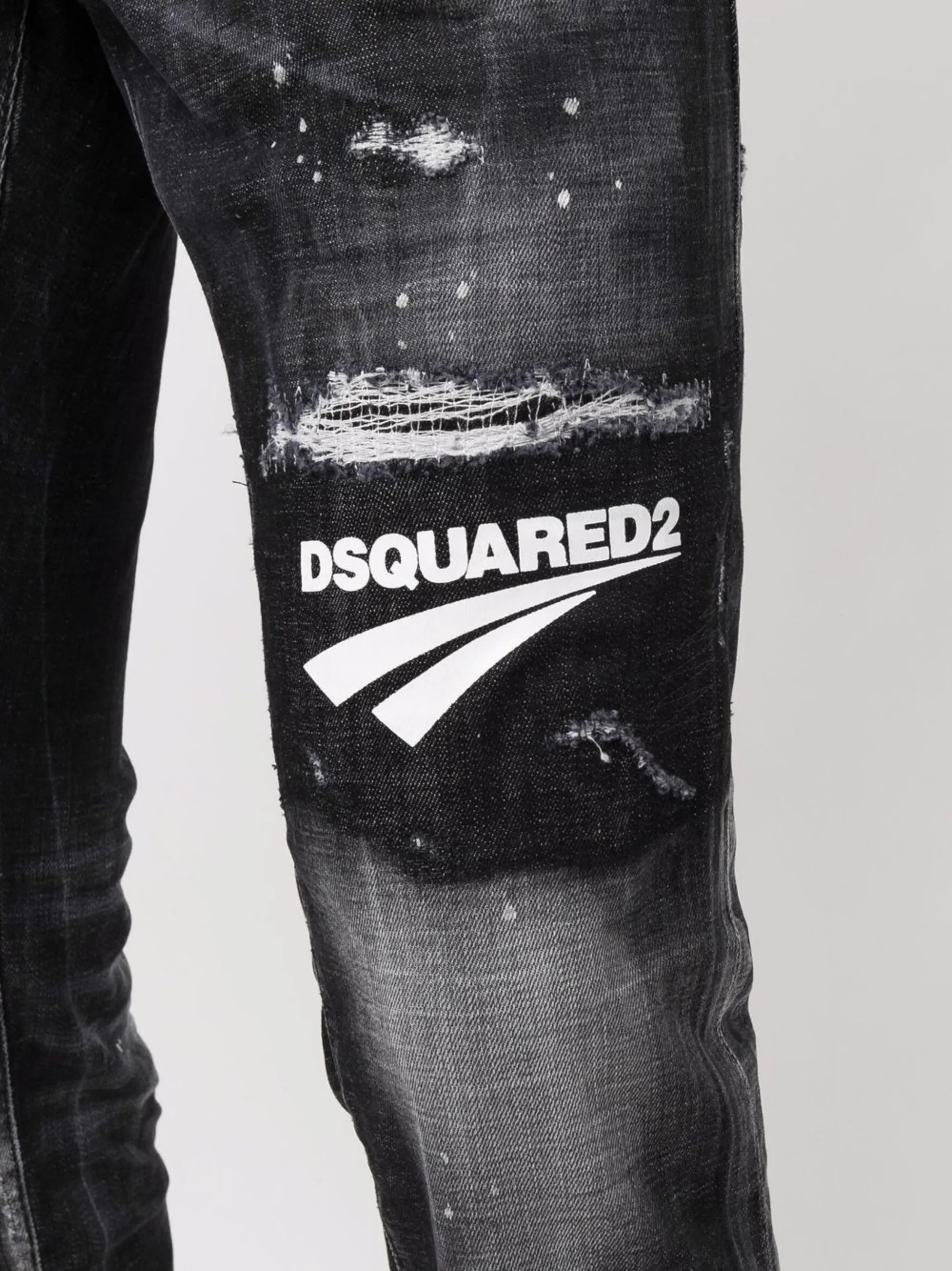 distressed logo patch jeans