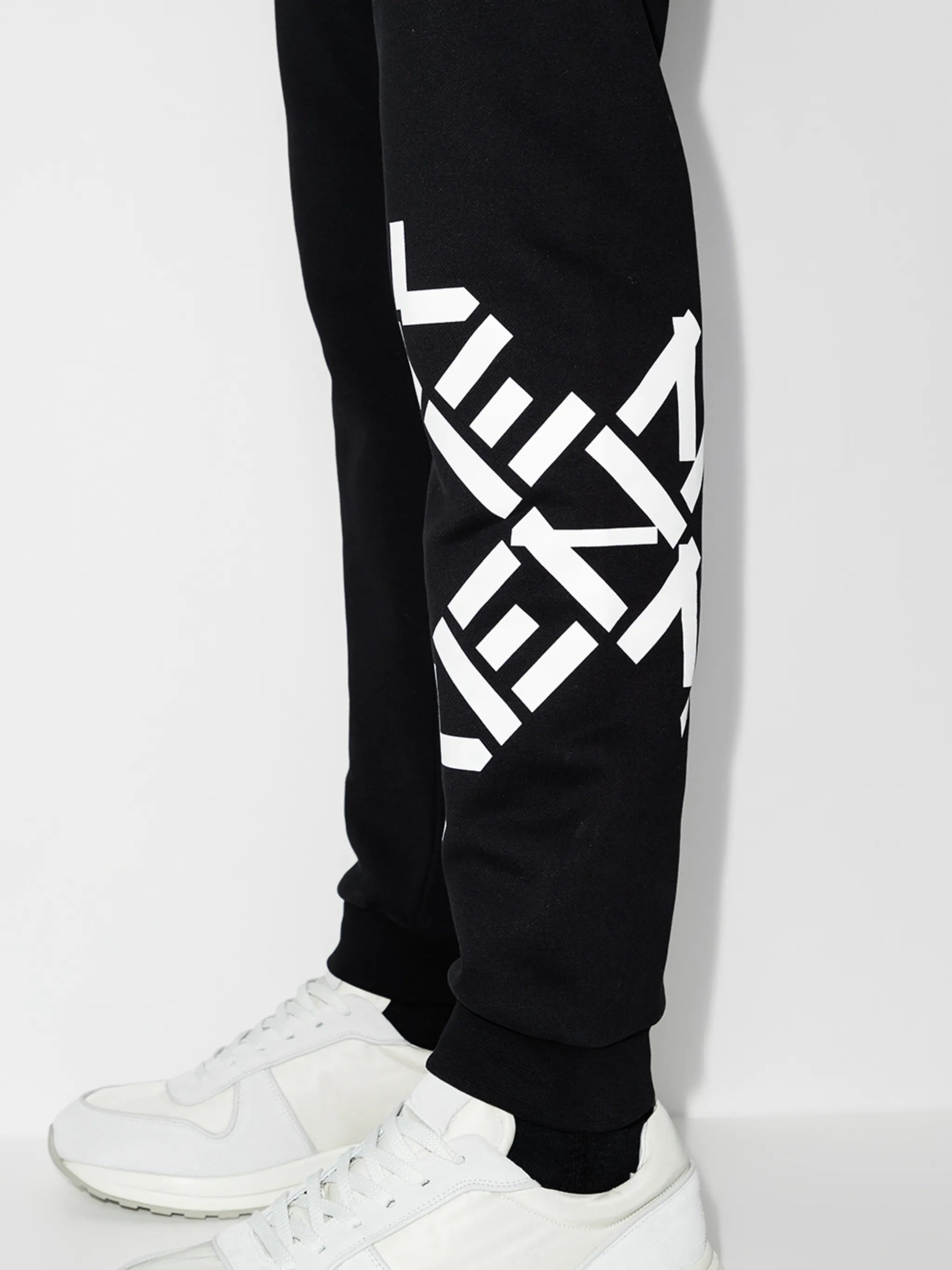 cross logo track pants