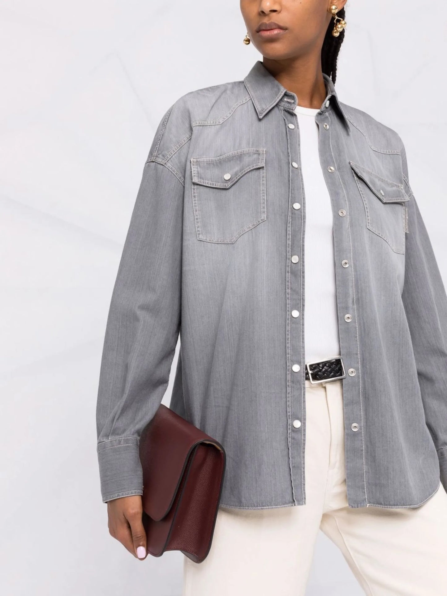 snap-fastening denim shirt