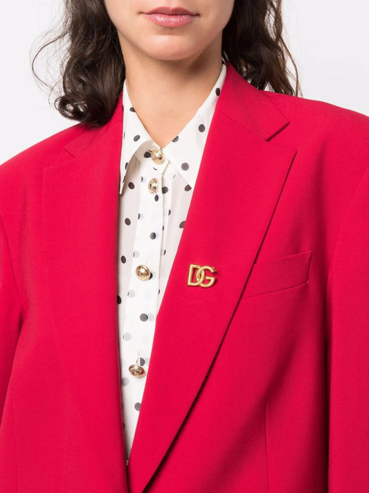 interlocking logo brooch