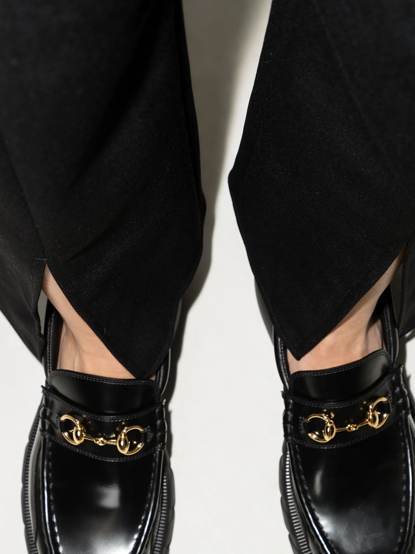 asymmetric hem high-waisted trousers