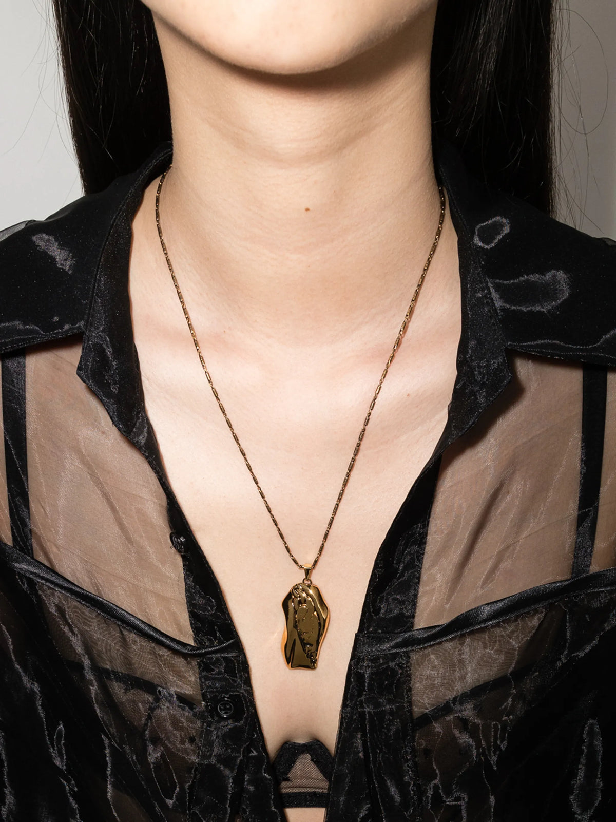Molten pendant necklace