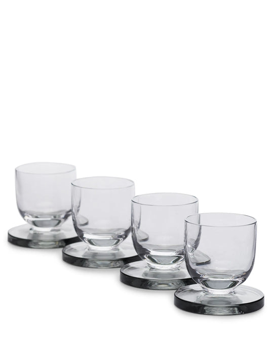 set of four Puck shot glasses